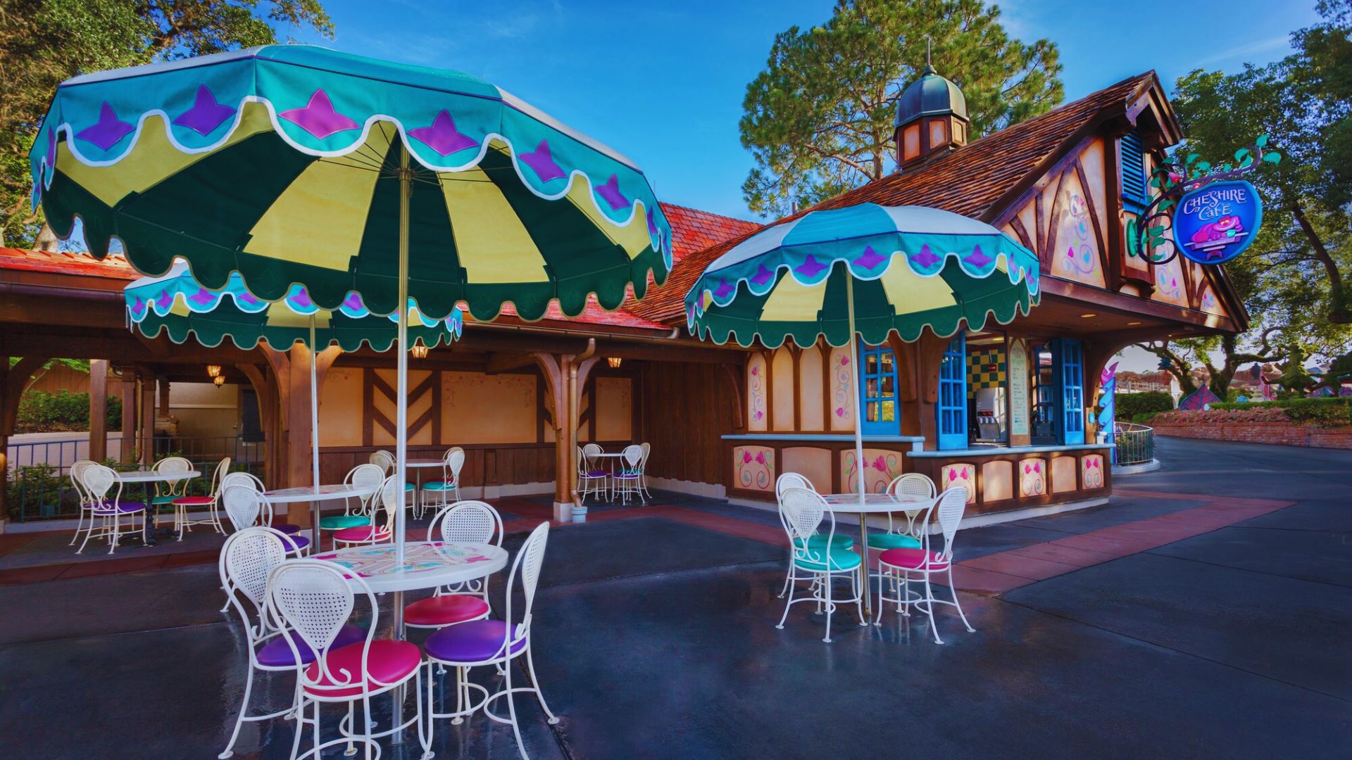 A restaurant's terrace showcasing an array of colorful umbrellas and tables, inviting guests to enjoy al fresco dining.