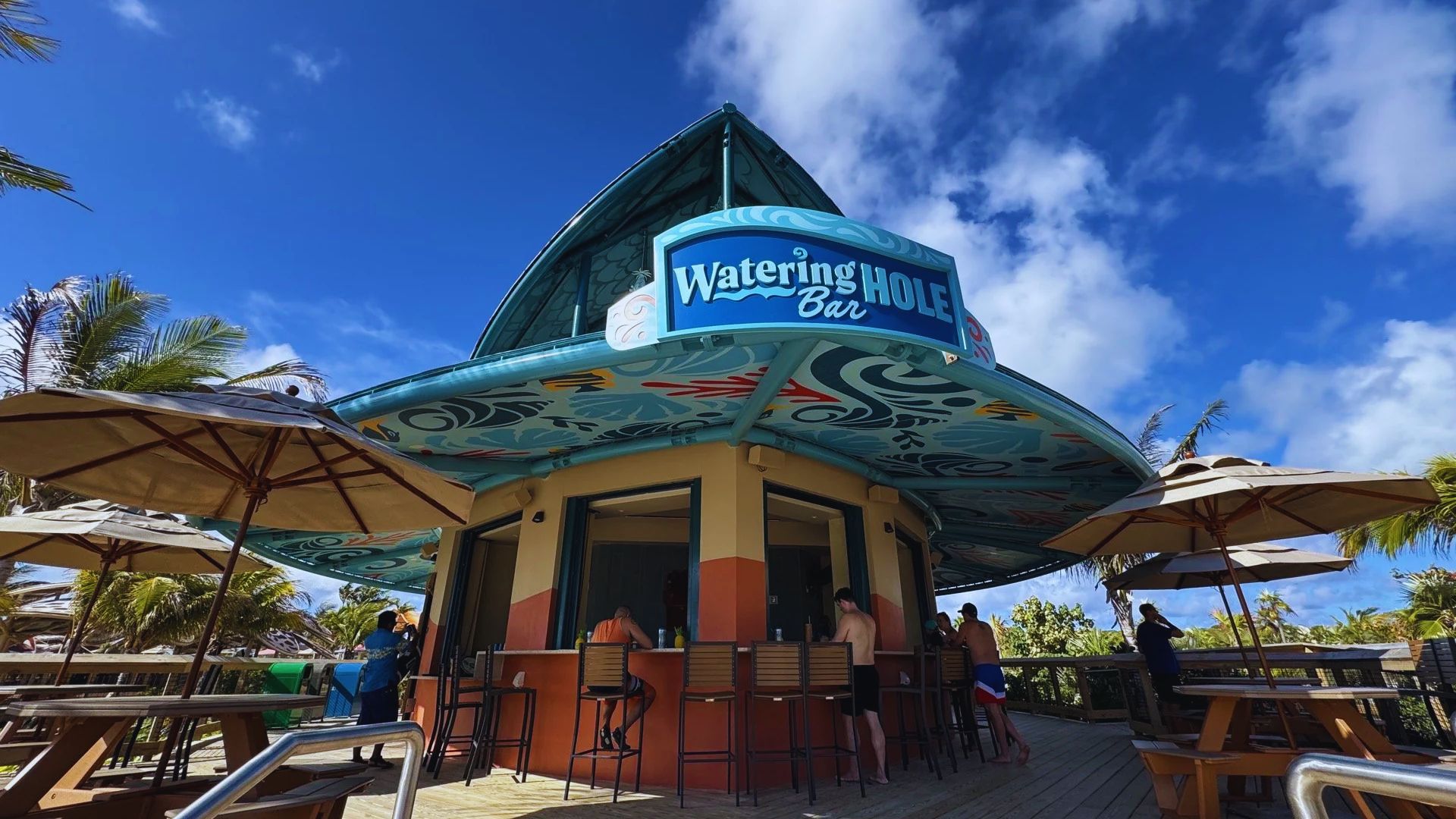 The Watergate Bar at the Watergate Resort in Maui, featuring tropical decor and ocean views.