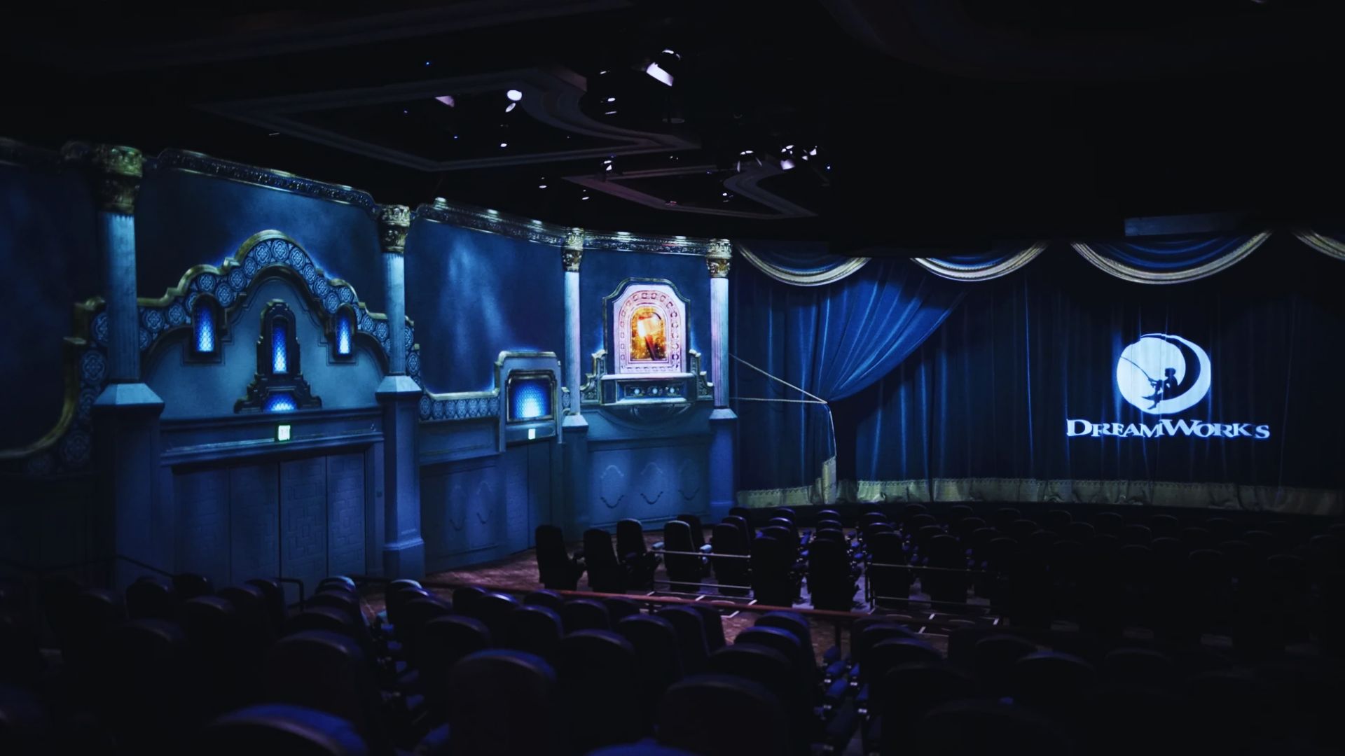 A vibrant theater at Disneyland, showcasing its iconic architecture and lively atmosphere filled with visitors.