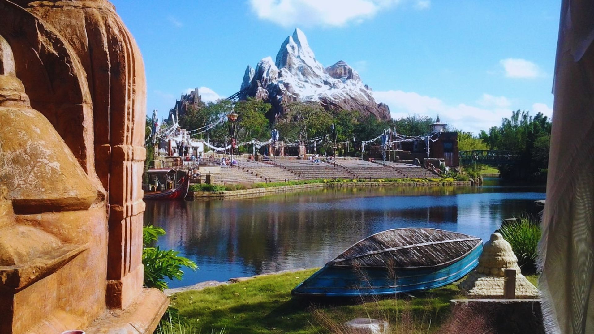 A picturesque landscape featuring water and mountains, captured from the perspective of a boat.