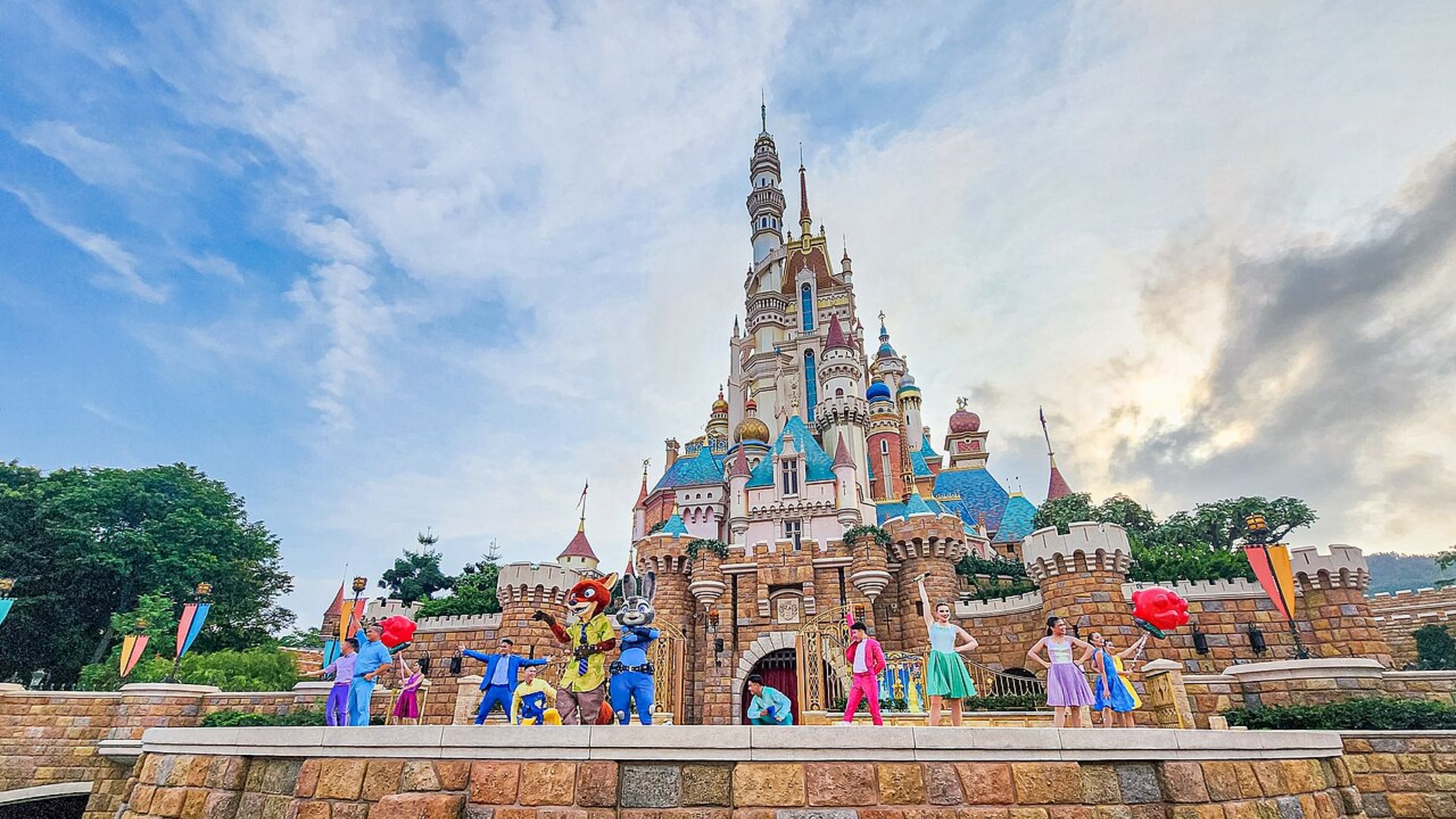 Disneyland's castle surrounded by a crowd of visitors enjoying the magical atmosphere of the theme park.