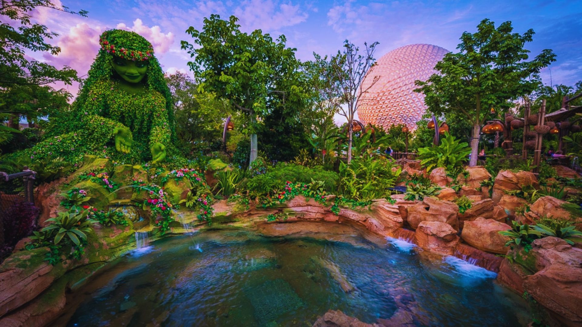 Epcot garden featuring a vibrant array of plants surrounded by tranquil water elements.