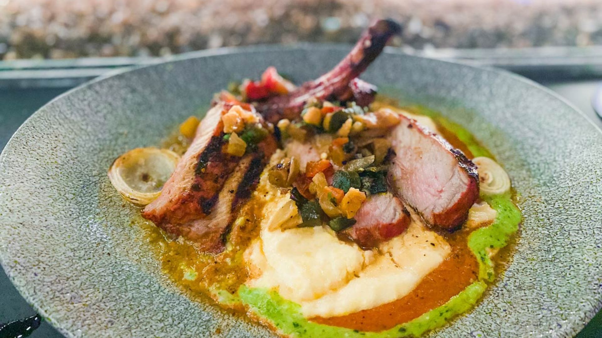A plate featuring a serving of meat alongside a colorful assortment of vegetables.