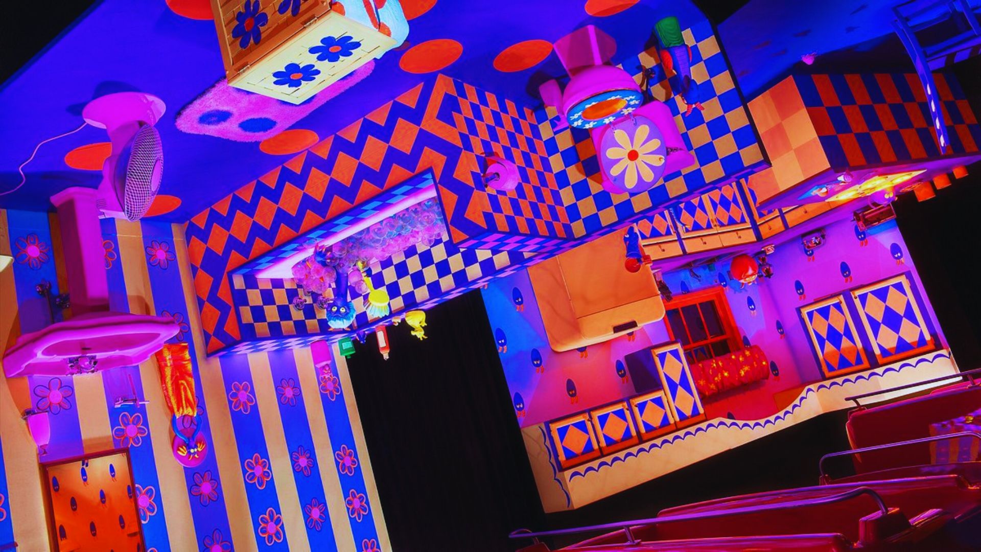 A vibrant room featuring a colorful ceiling and wall, creating a lively and cheerful atmosphere.