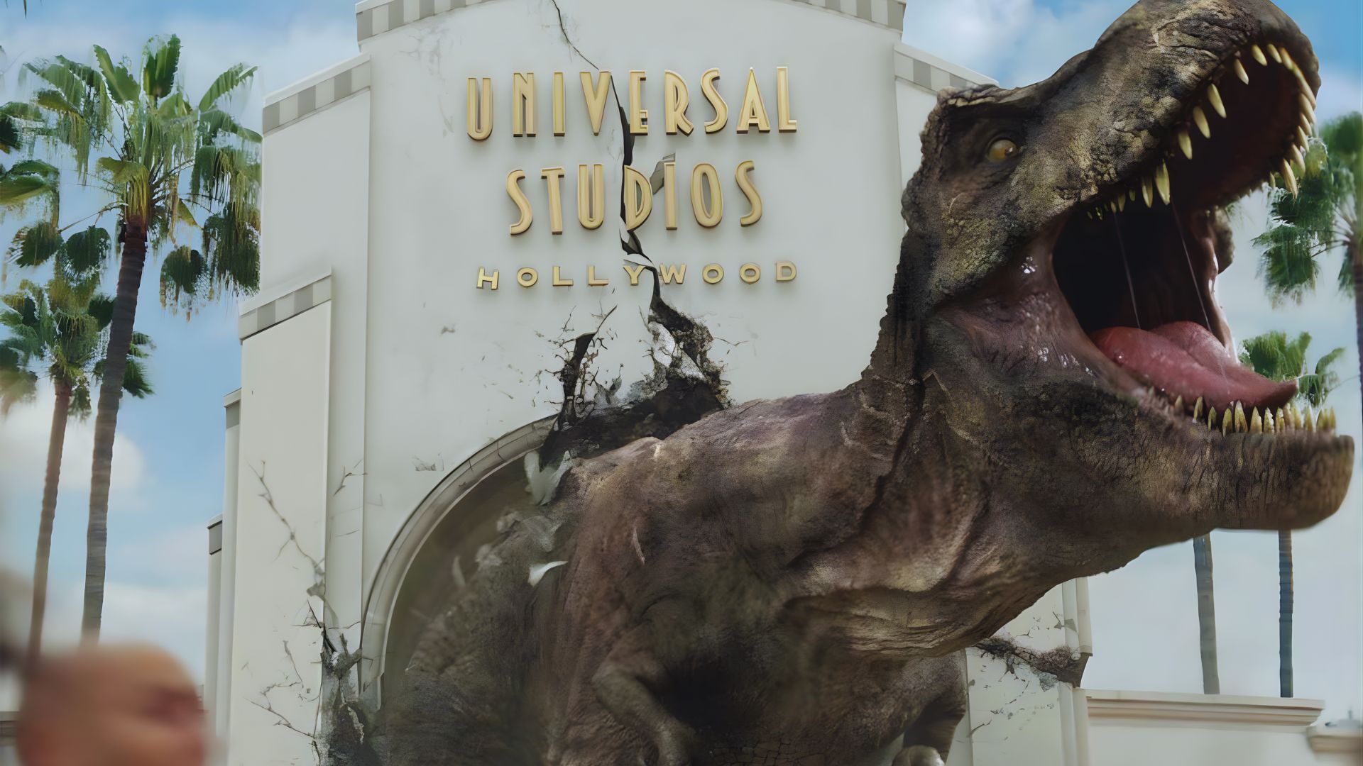 The Jurassic Park ride entrance at Universal Studios, featuring themed decor and vibrant signage.