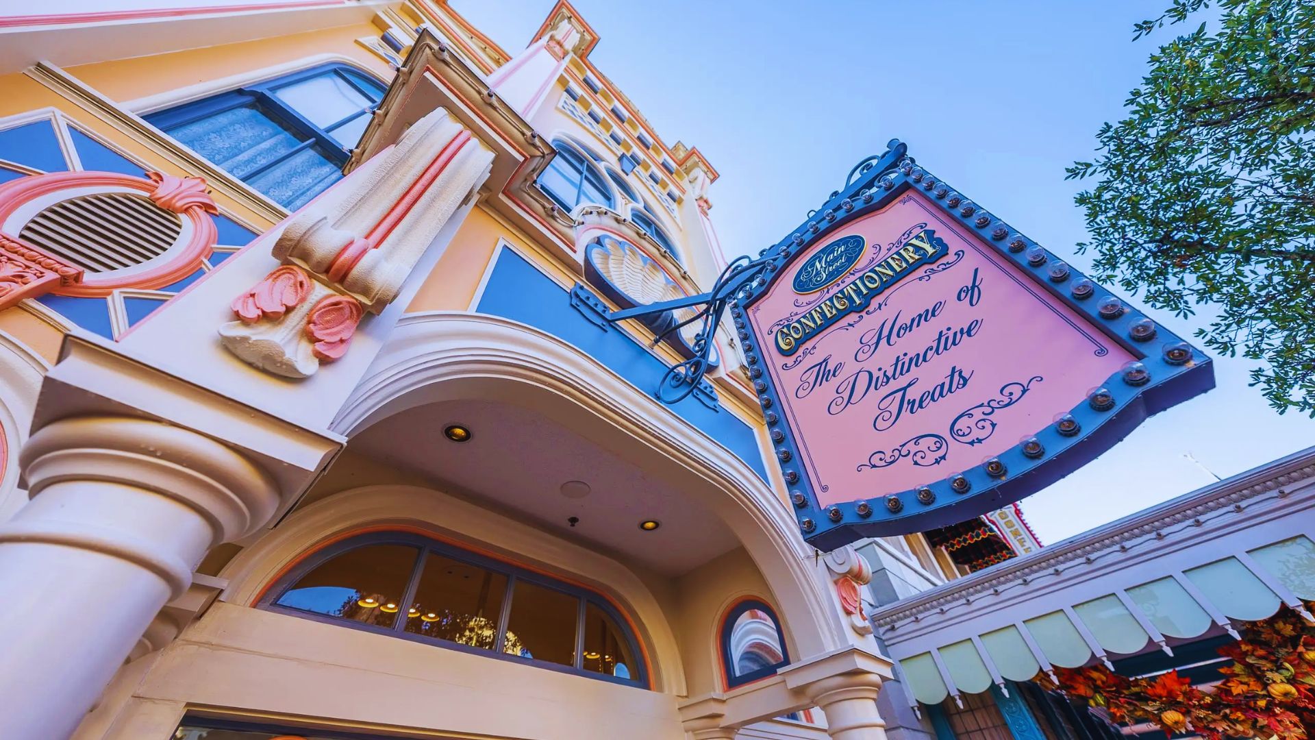 The sign for the Disneyland Hotel is clearly visible on the side of the hotel structure.