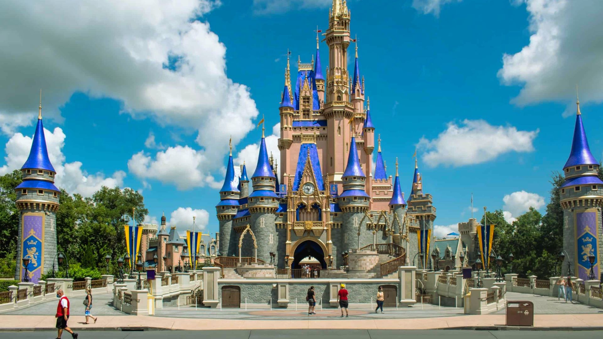 Disney World's castle, adorned in blue with striking blue turrets, stands majestically.