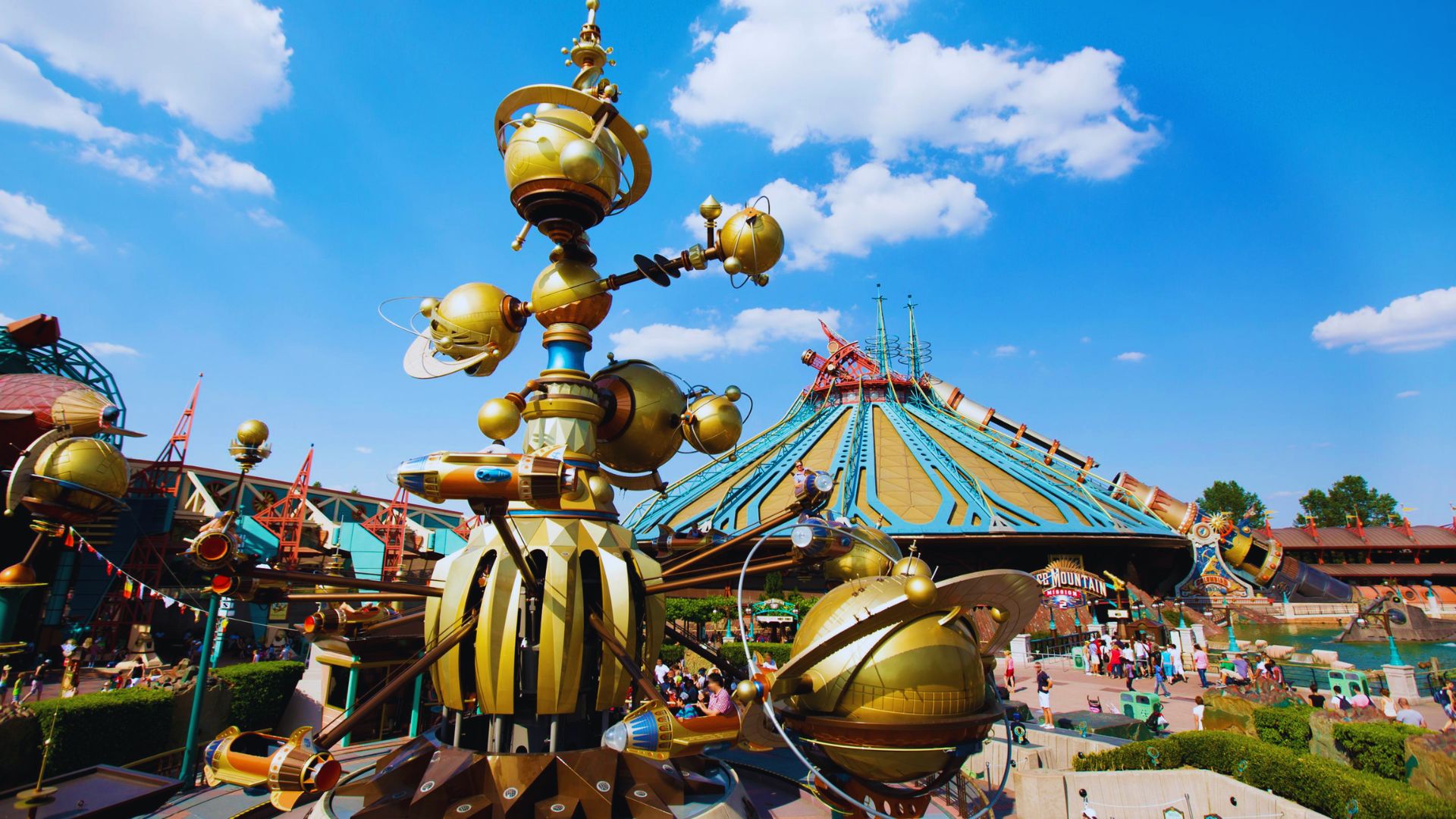 A shimmering golden globe located in Disneyland Paris, capturing the essence of joy and wonder for visitors.