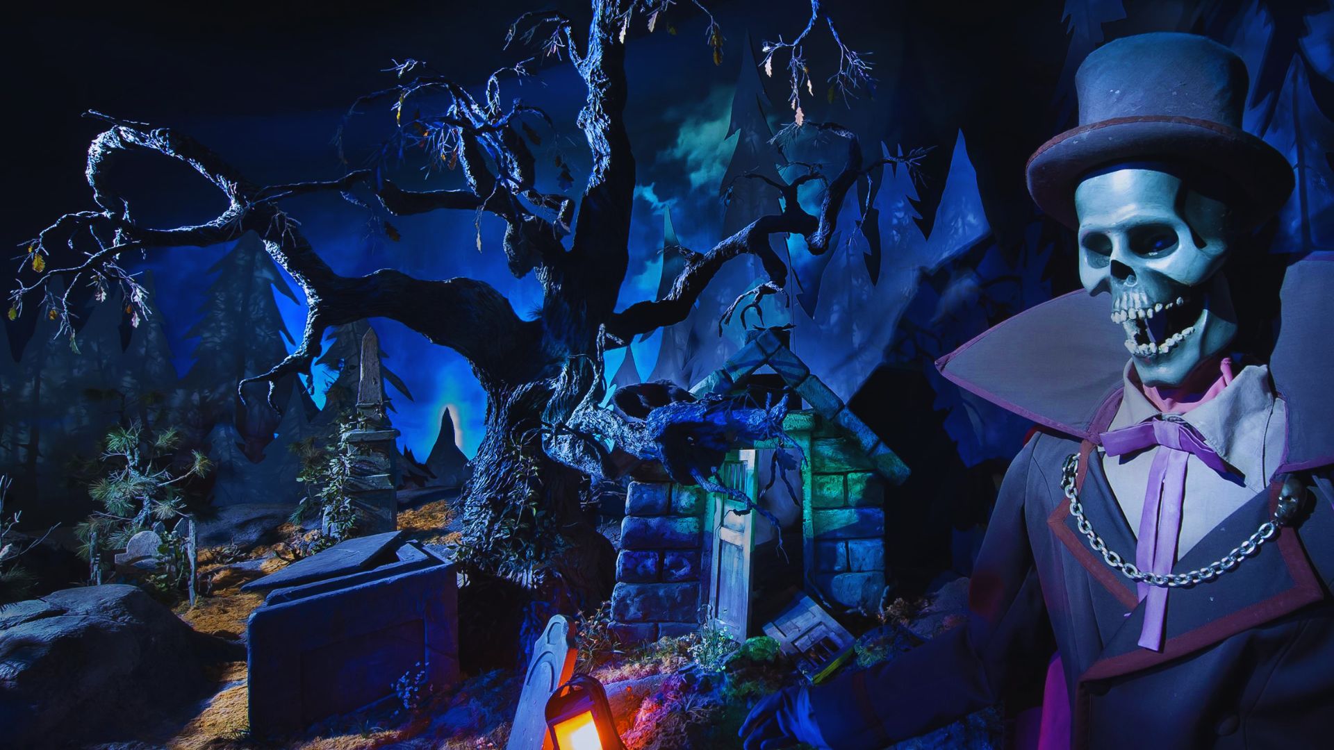 A skeleton in a top hat stands in front of a graveyard, surrounded by tombstones under a cloudy sky.