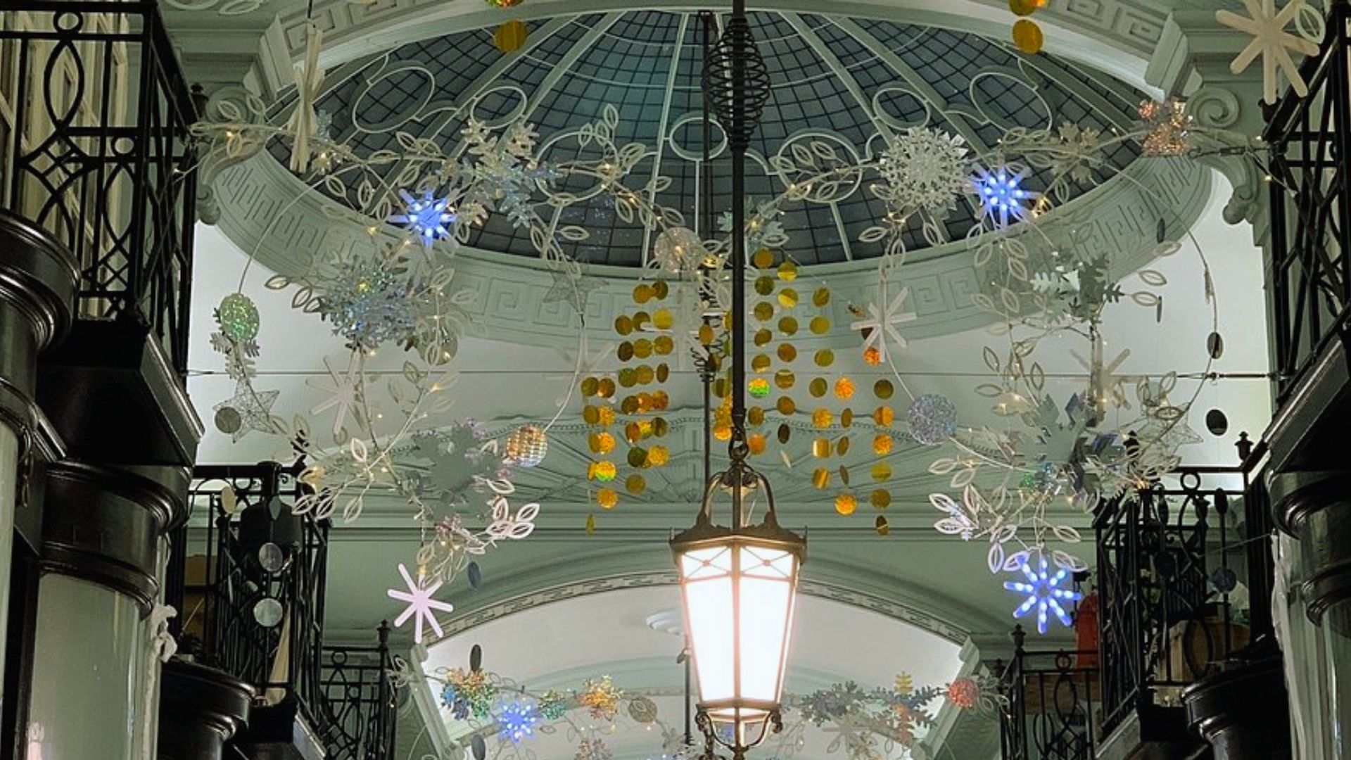 A spacious hallway featuring a ceiling adorned with intricate snowflake decorations.