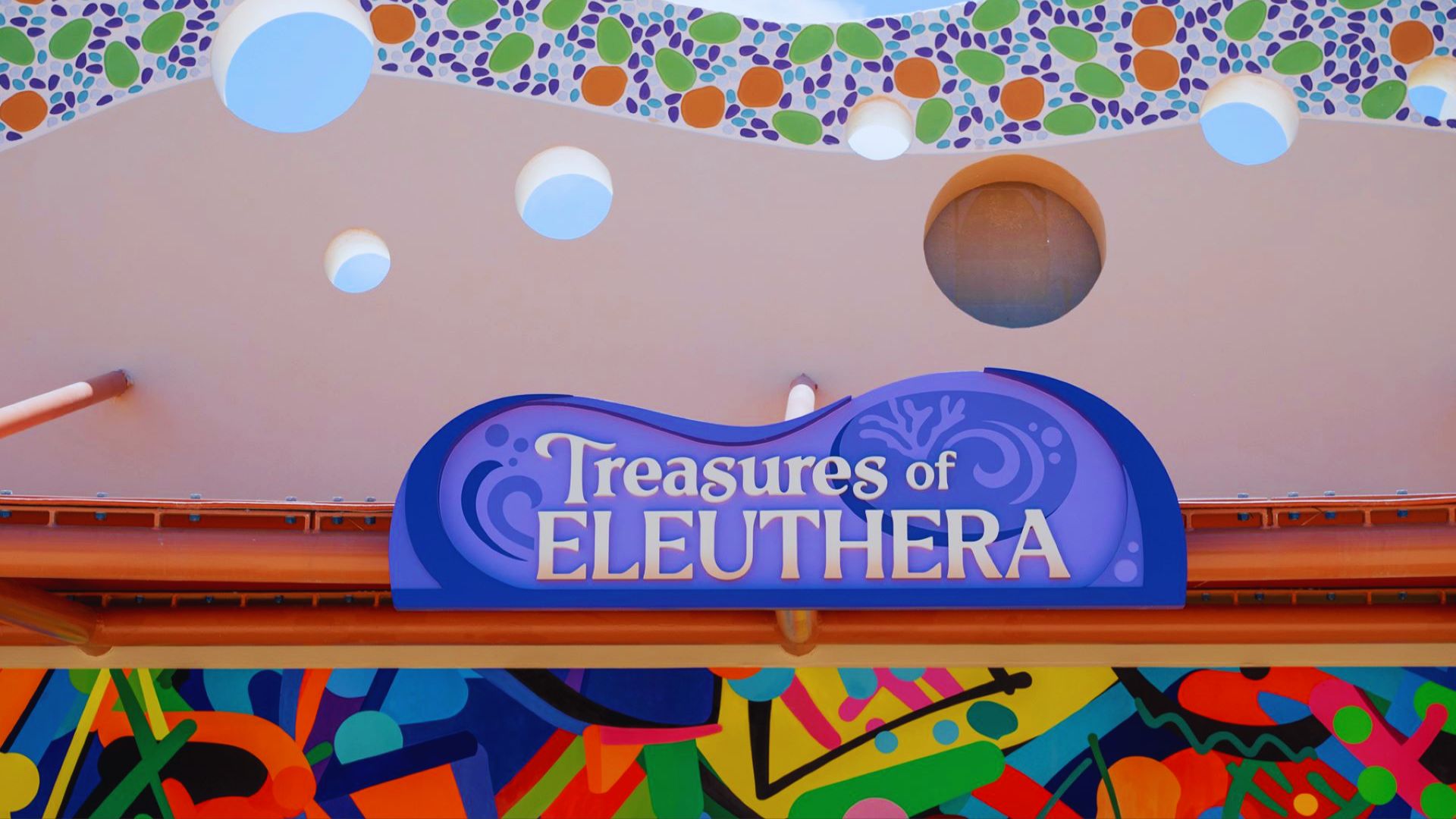 The ornate entrance to the treasure of Elutherea, featuring intricate carvings and a grand archway.