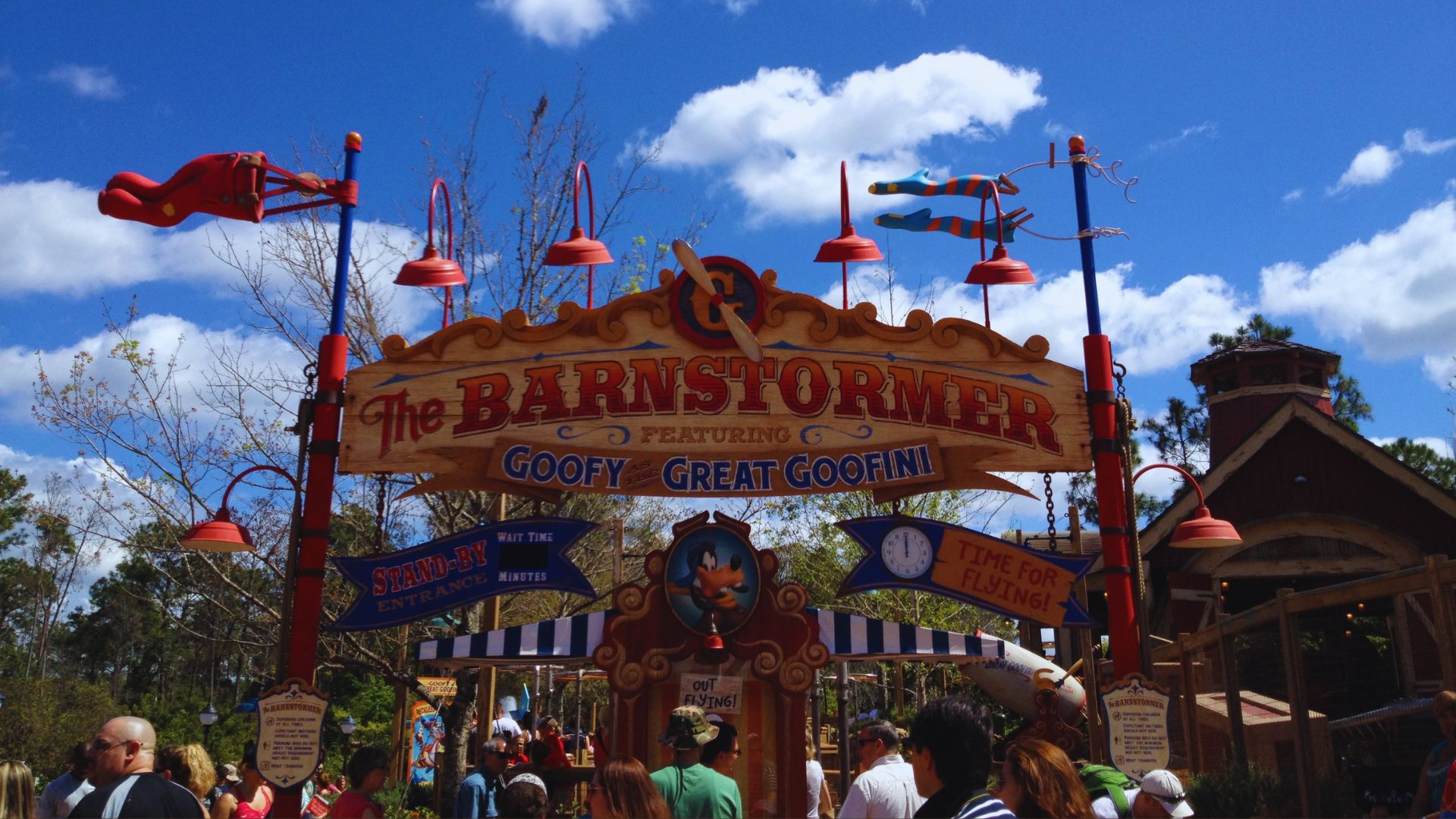 The Barnstormer ride at Disney's Epcot, featuring colorful planes and a whimsical design in a vibrant theme park setting.