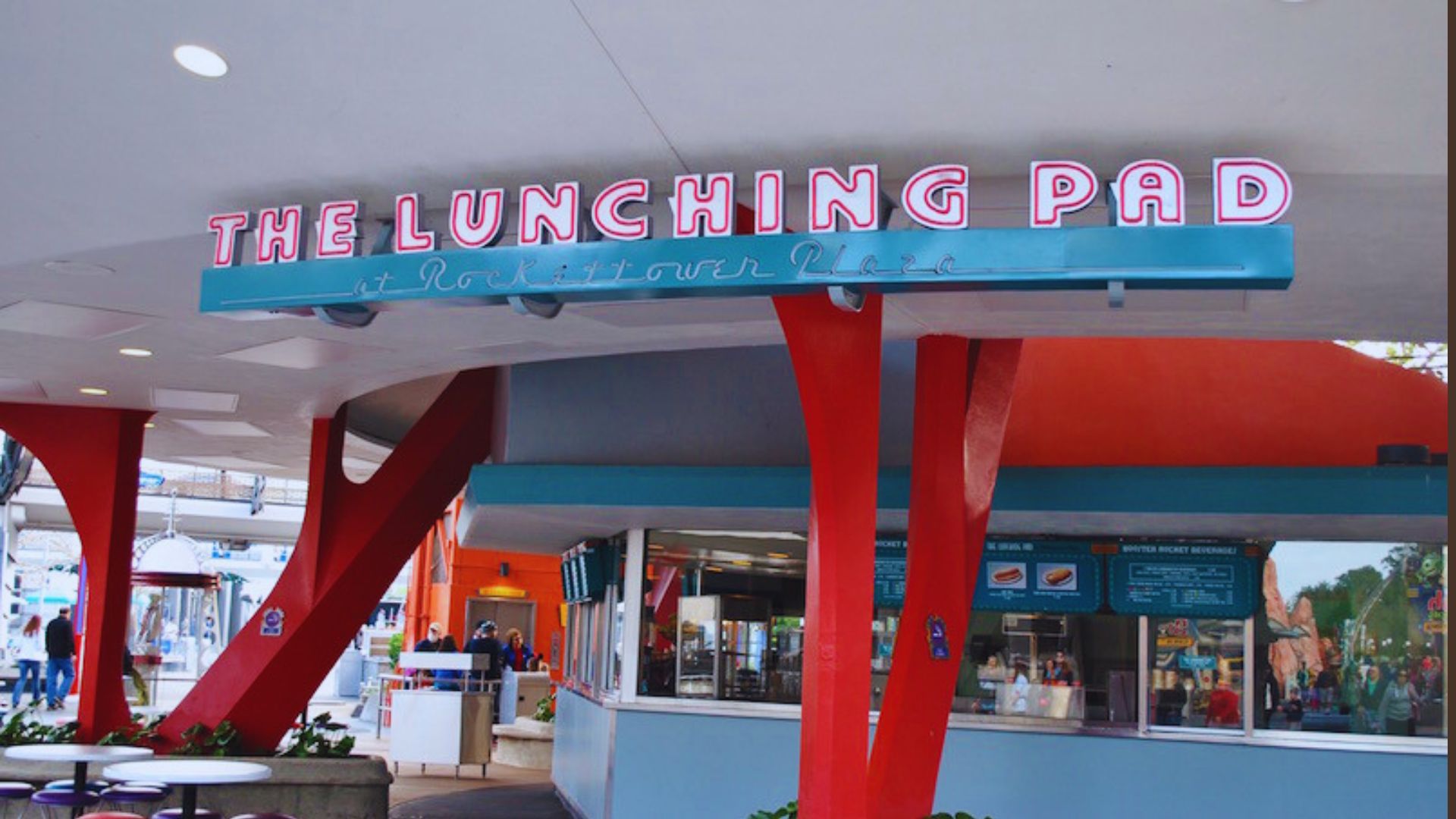 he Lunching Pad at Disneyland, featuring outdoor seating and a vibrant atmosphere for enjoying quick meals.