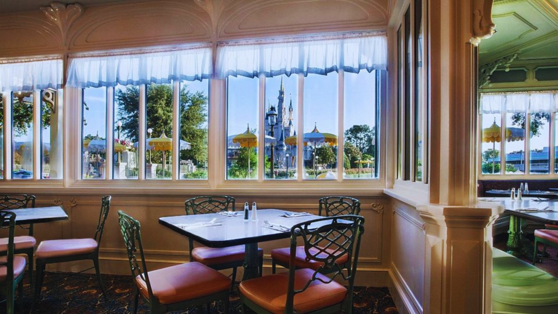 Elegant dining room at the Disneyland Hotel, featuring whimsical decor and a cozy atmosphere for guests.