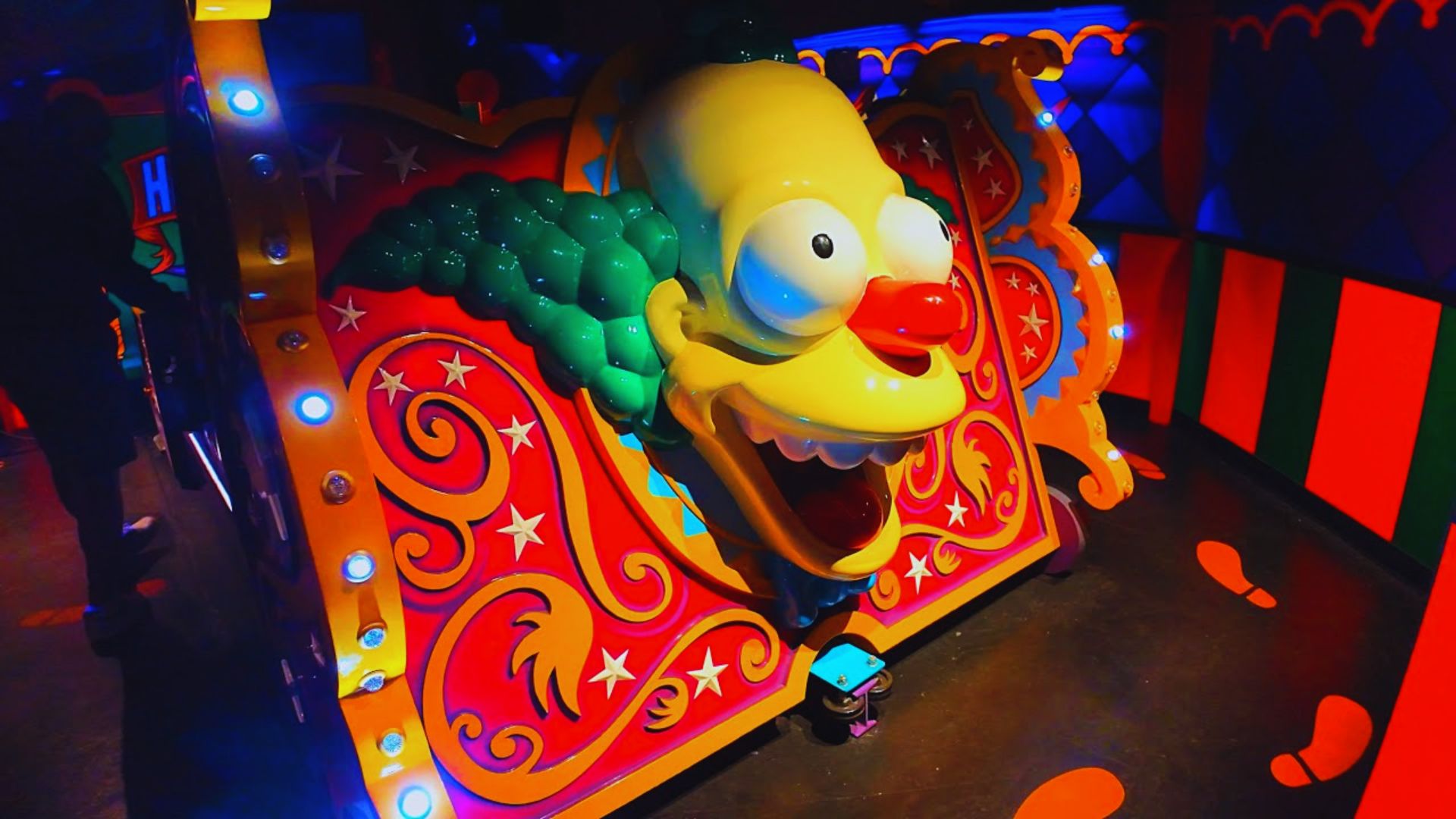 The Simpsons Ride at Disneyland, featuring vibrant characters and a thrilling roller coaster experience.