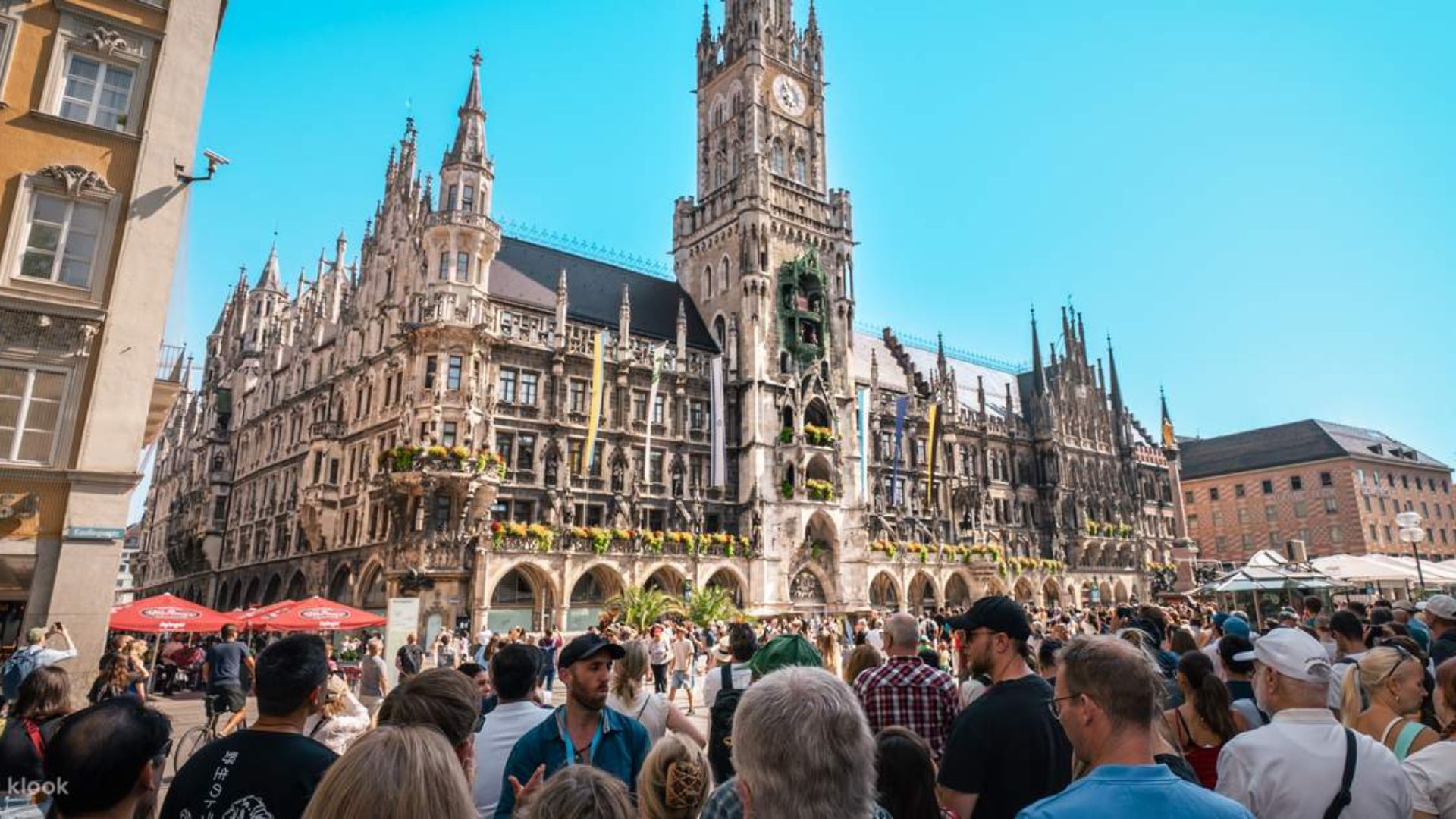 People stroll through the streets of Munich, Germany, enjoying the vibrant city atmosphere and architecture.