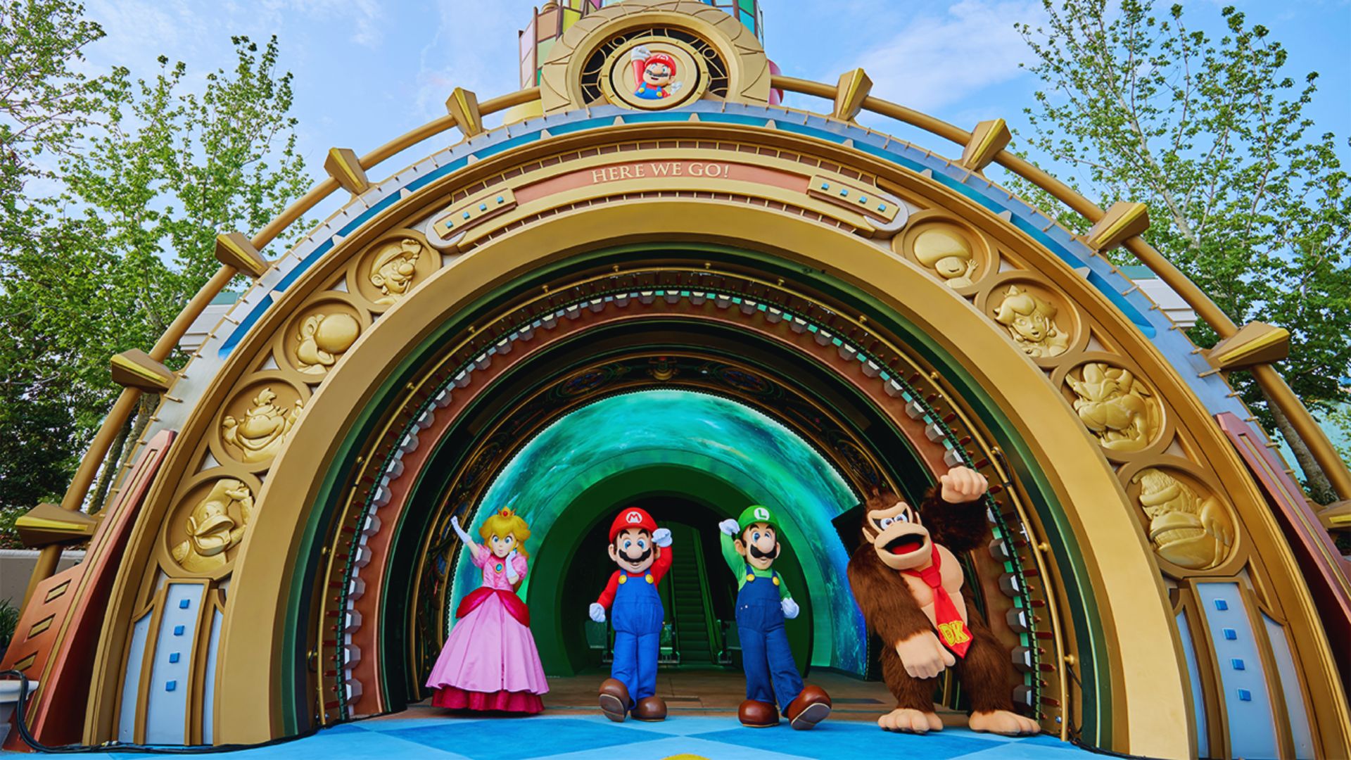 A group of individuals poses in front of a towering castle, highlighting its grandeur and historical significance.