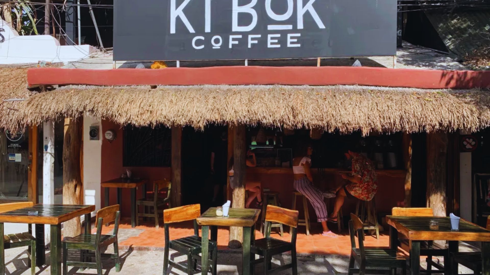 The Kibuk coffee shop in Kuwait, featuring a modern interior and outdoor seating area filled with patrons enjoying their drinks.