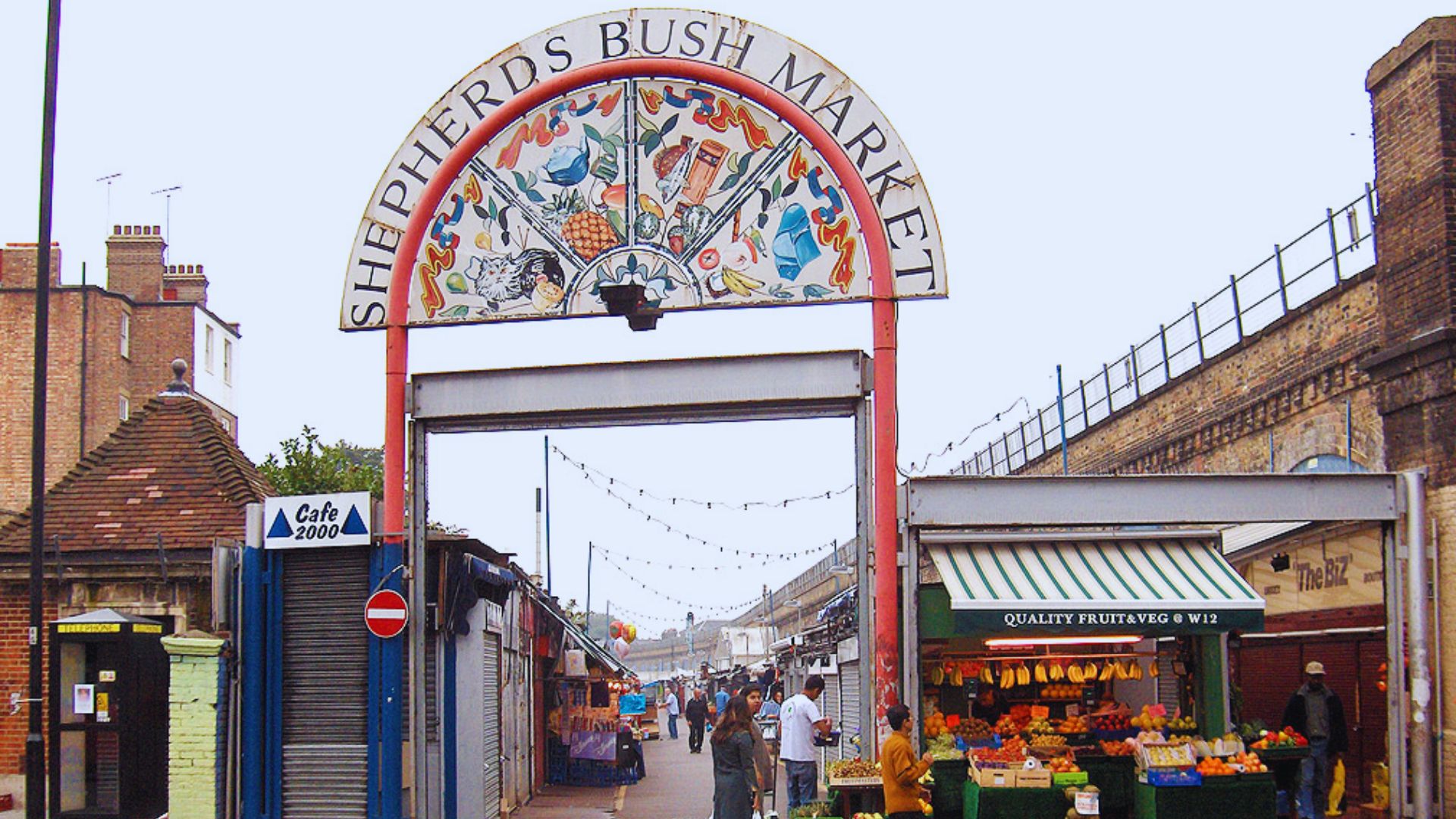 A large archway featuring a sign that reads "Sussex Market," welcoming visitors to the market area.