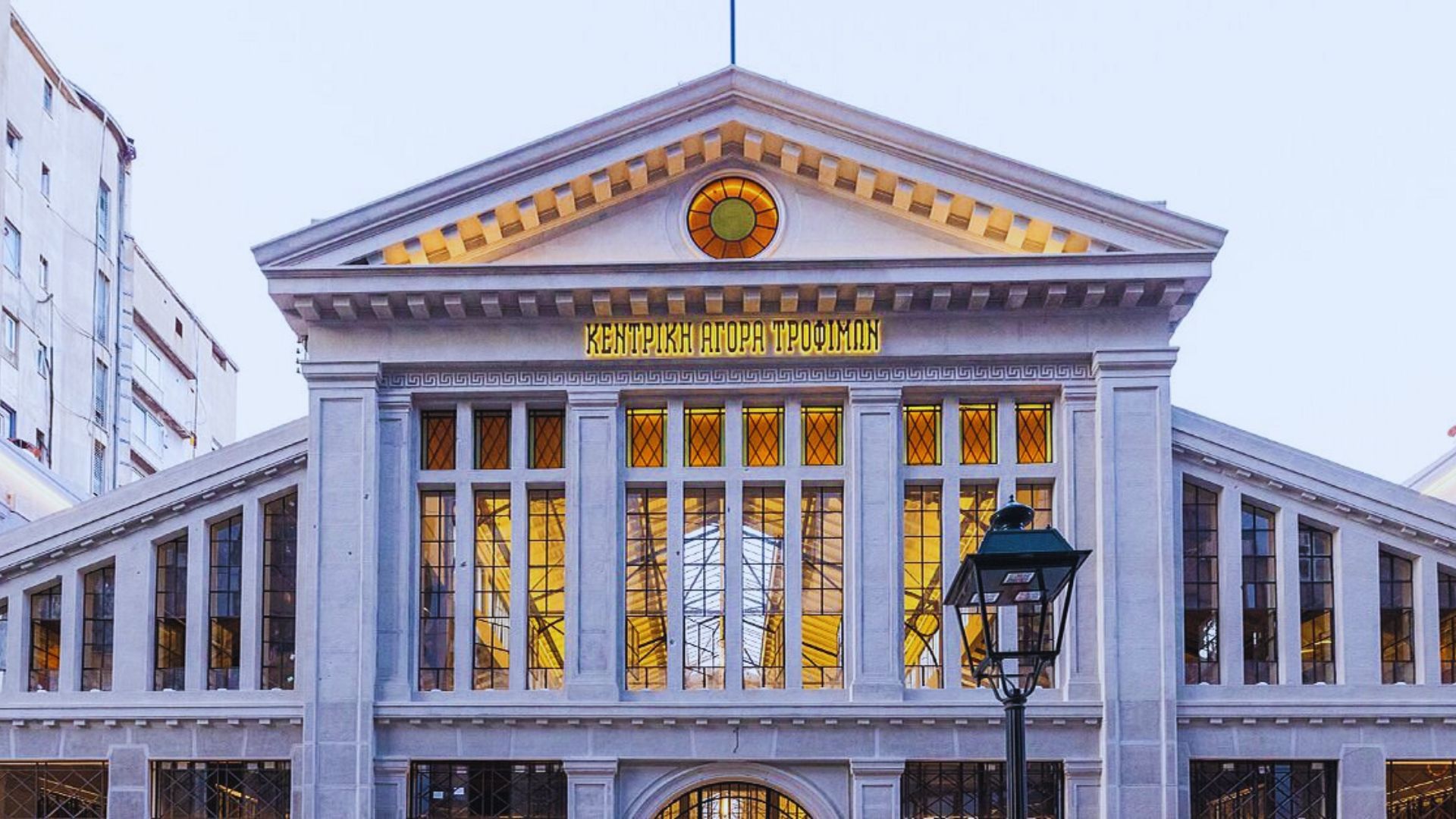 A large clock prominently displayed on the front of the building.