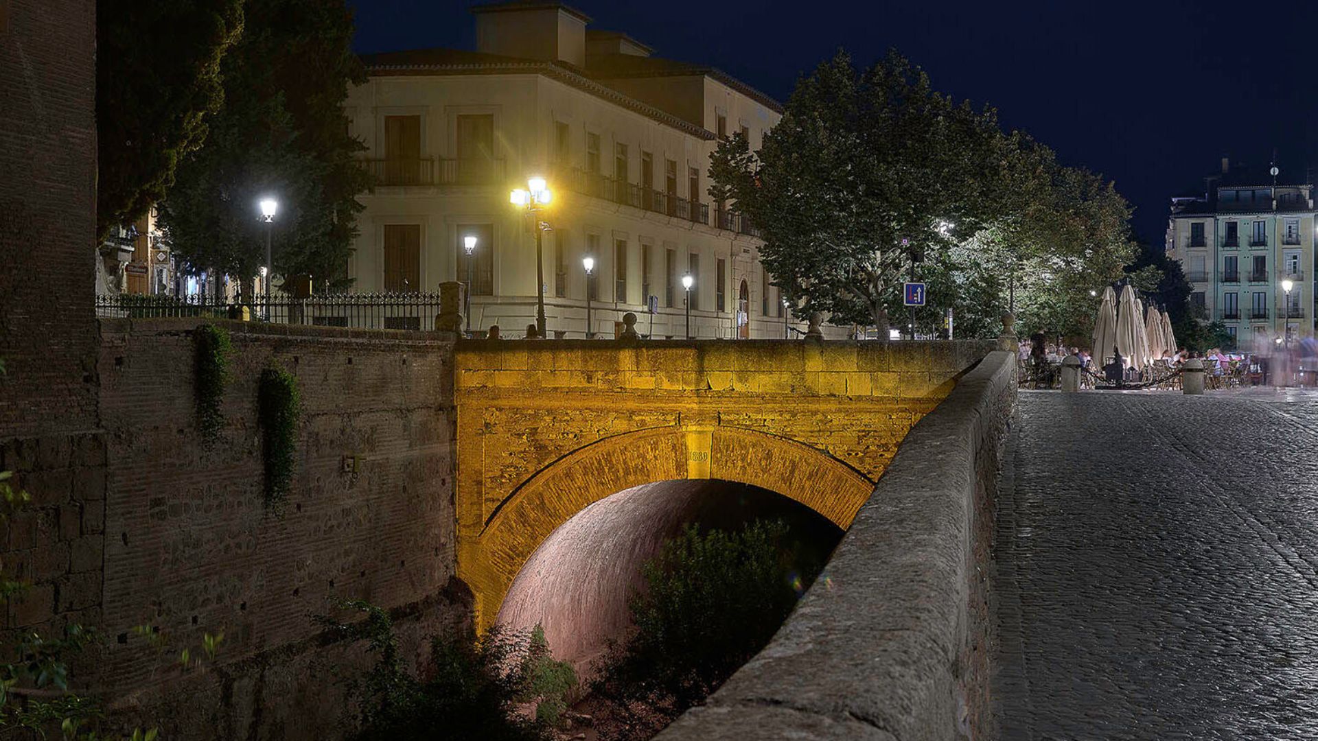 15. Walk Along the Darro River at Night