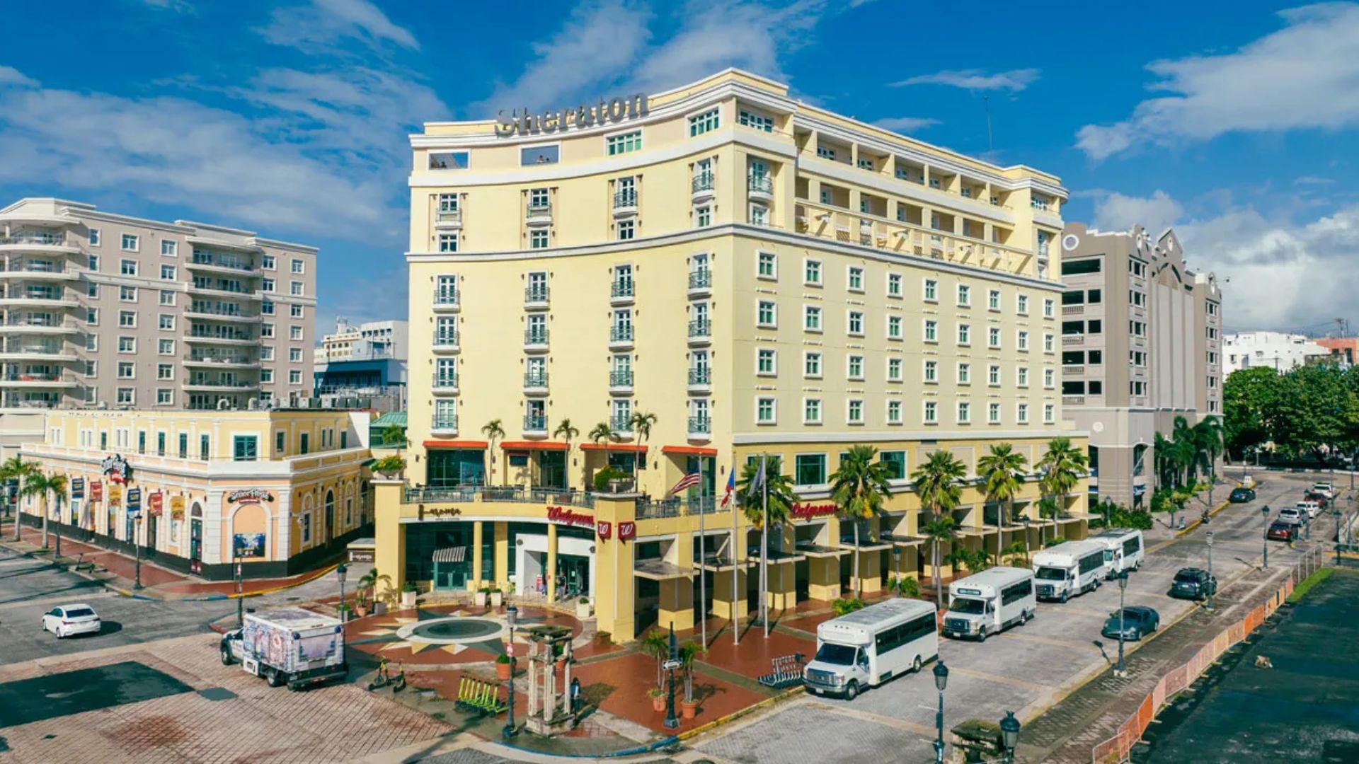 A hotel situated in the heart of a bustling city, surrounded by urban architecture and vibrant city life.