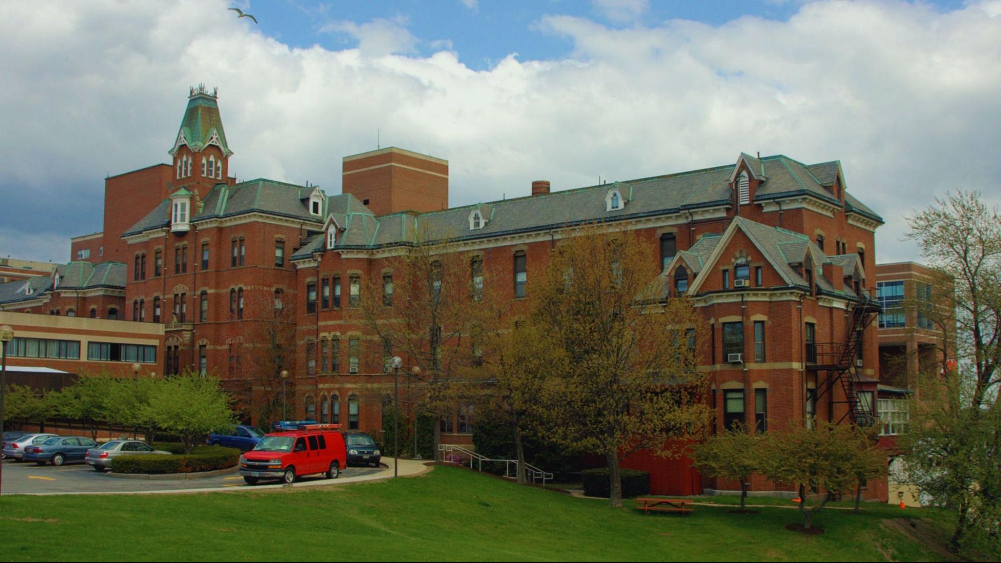 A large building featuring numerous windows, showcasing a modern architectural design.