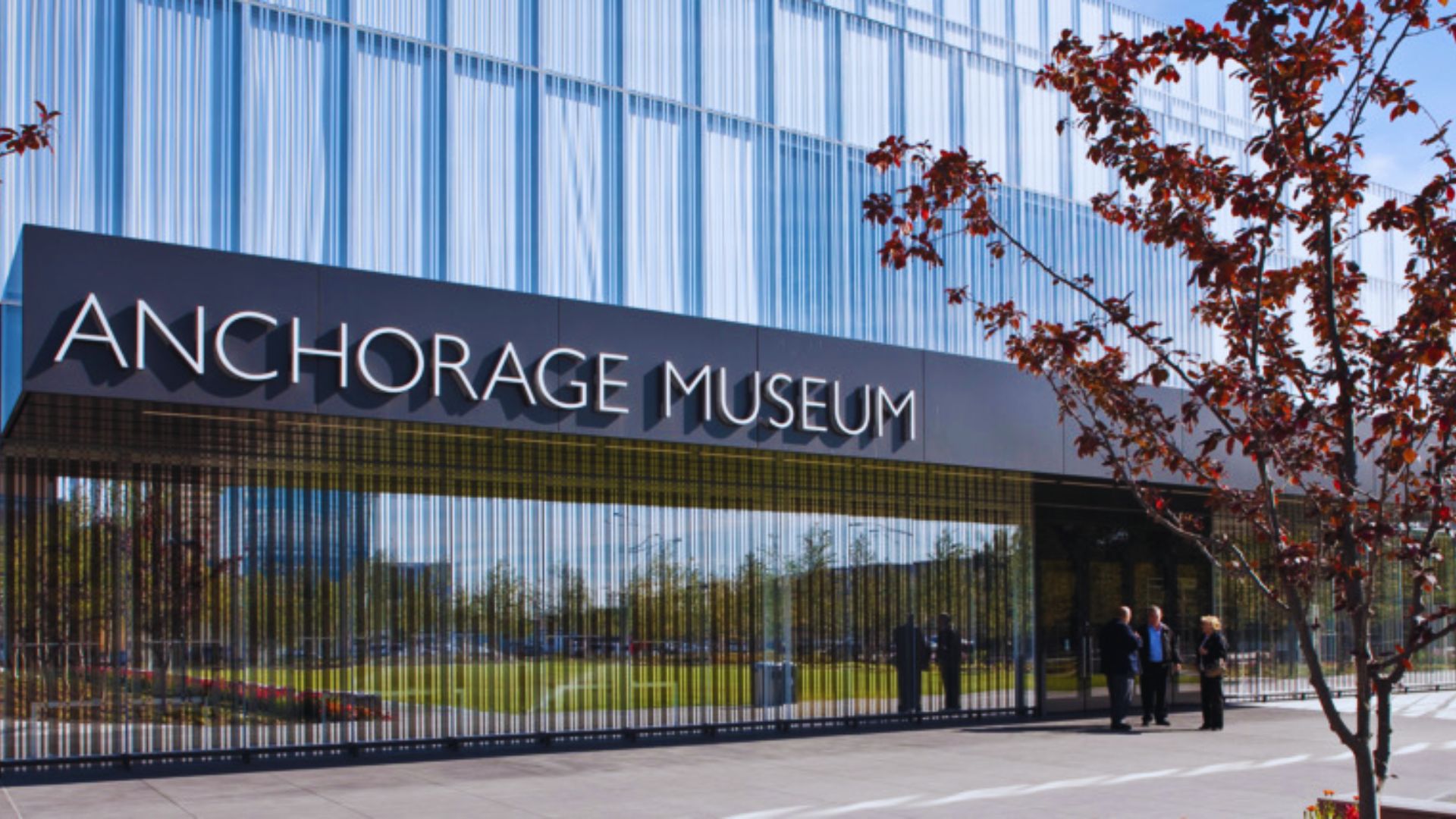 Exterior view of the Anchorage Museum of the Arts, showcasing modern architecture and surrounding landscape.