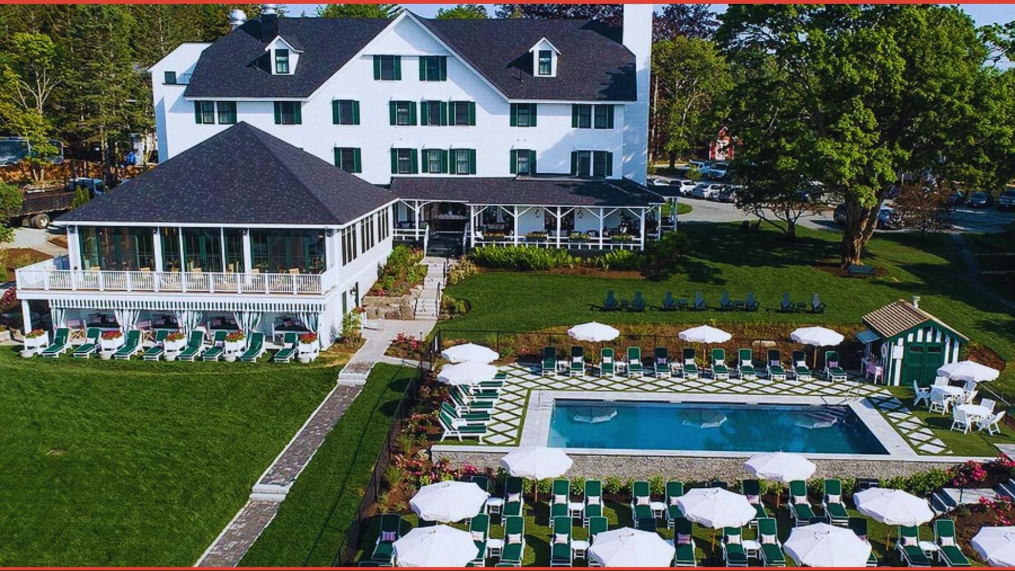 The Inn at the Lake, a charming lodge surrounded by serene waters and lush greenery, inviting guests to relax and unwind.