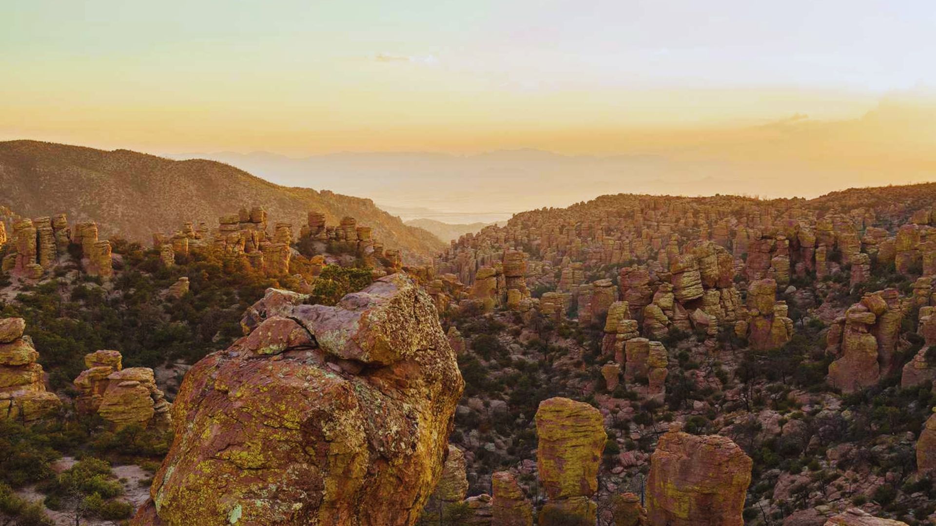 Sunset over the Grand Canyon, showcasing vibrant colors in the sky, captured by photographer Jimmy Kirk.