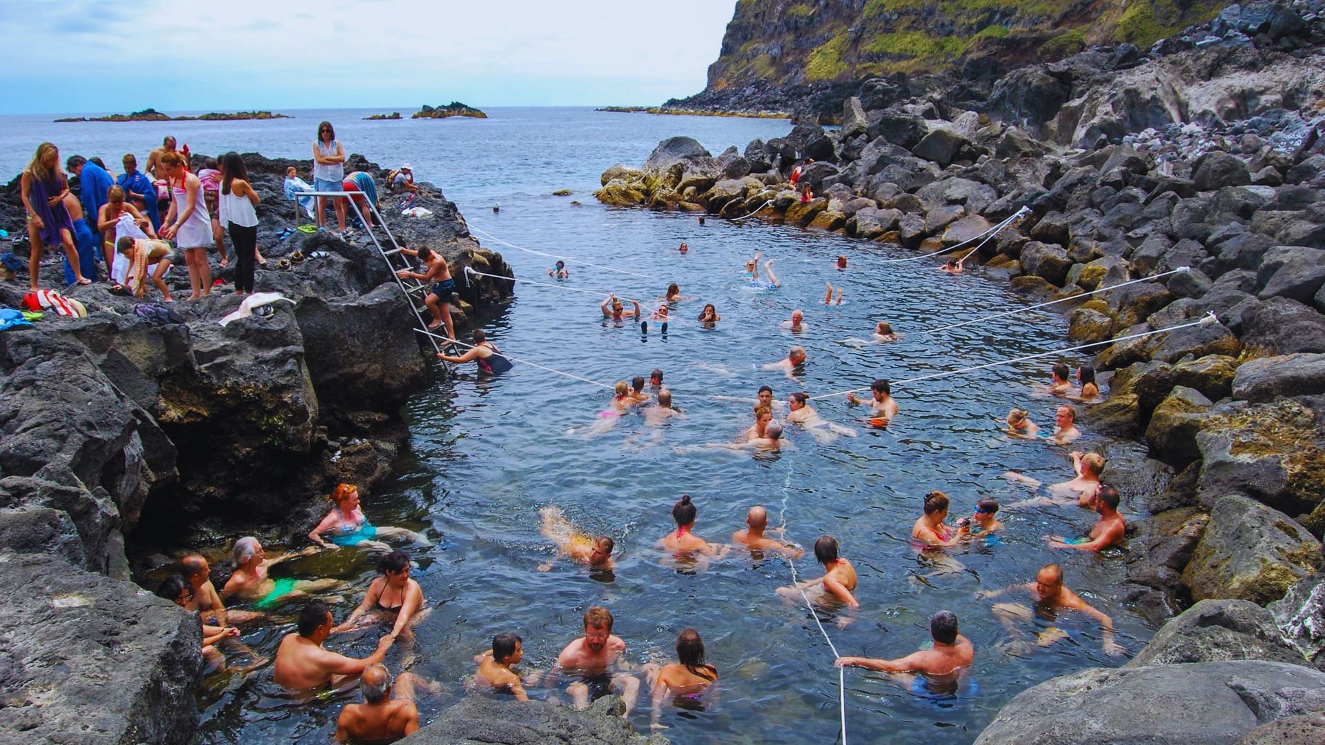 Swim at Ponta da Ferraria Thermal Pool