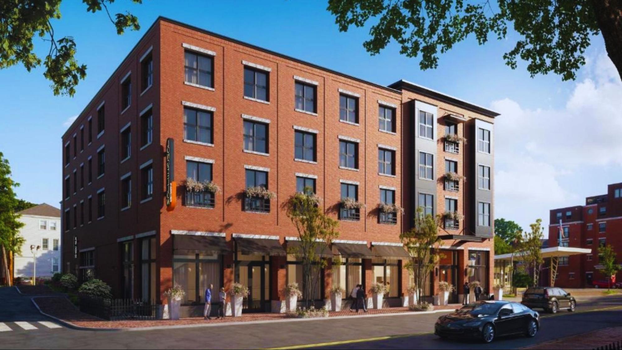New building design at the corner of a street, showcasing modern architecture and urban planning.