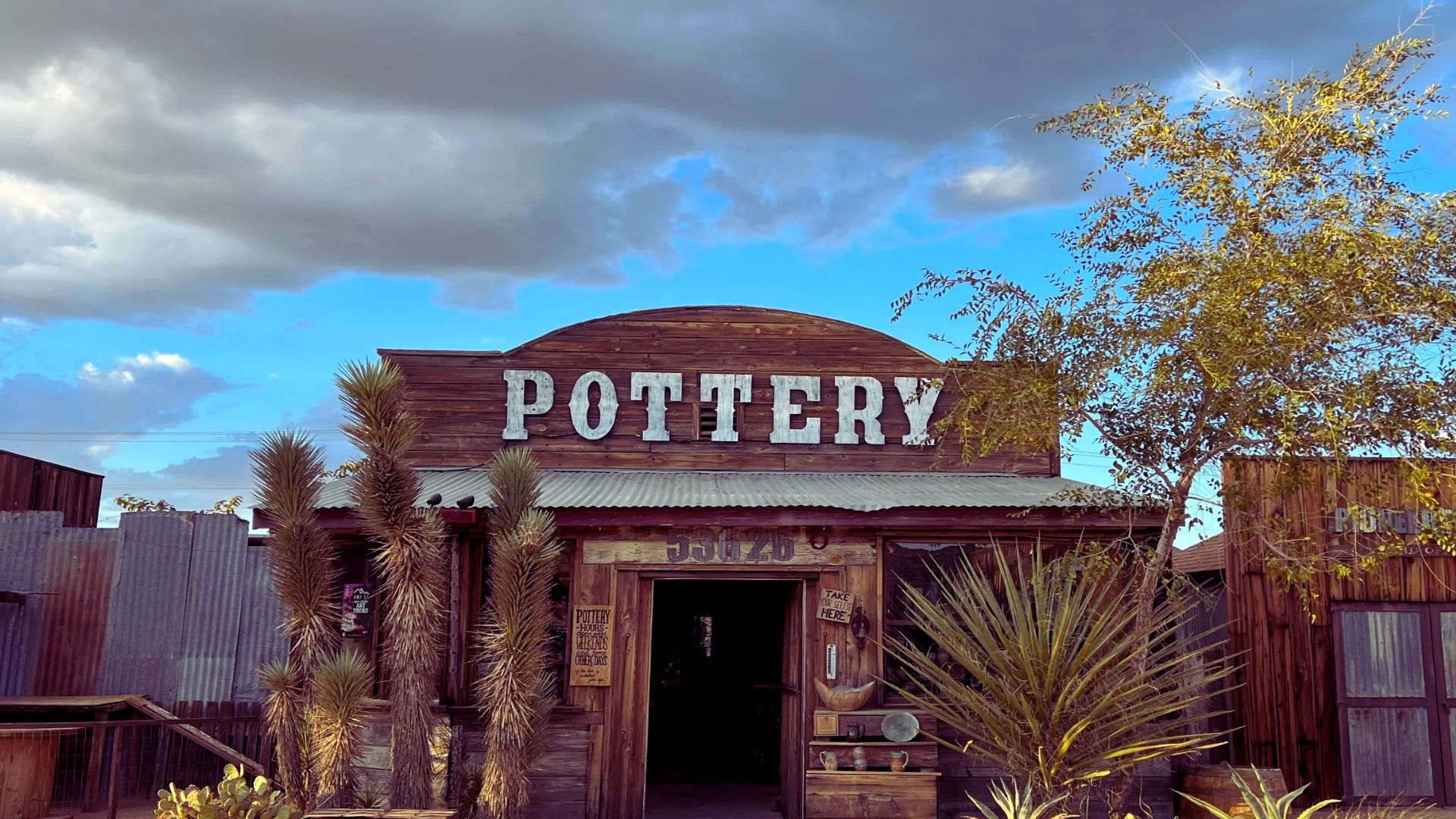 A collection of handcrafted desert pottery featuring earthy tones and unique textures, showcasing traditional craftsmanship.