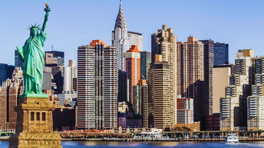 2 Days in New York Itinerary: Visit NYC Highlights Fast The Statue of Liberty stands prominently with the New York City skyline in the background, showcasing urban landmarks.