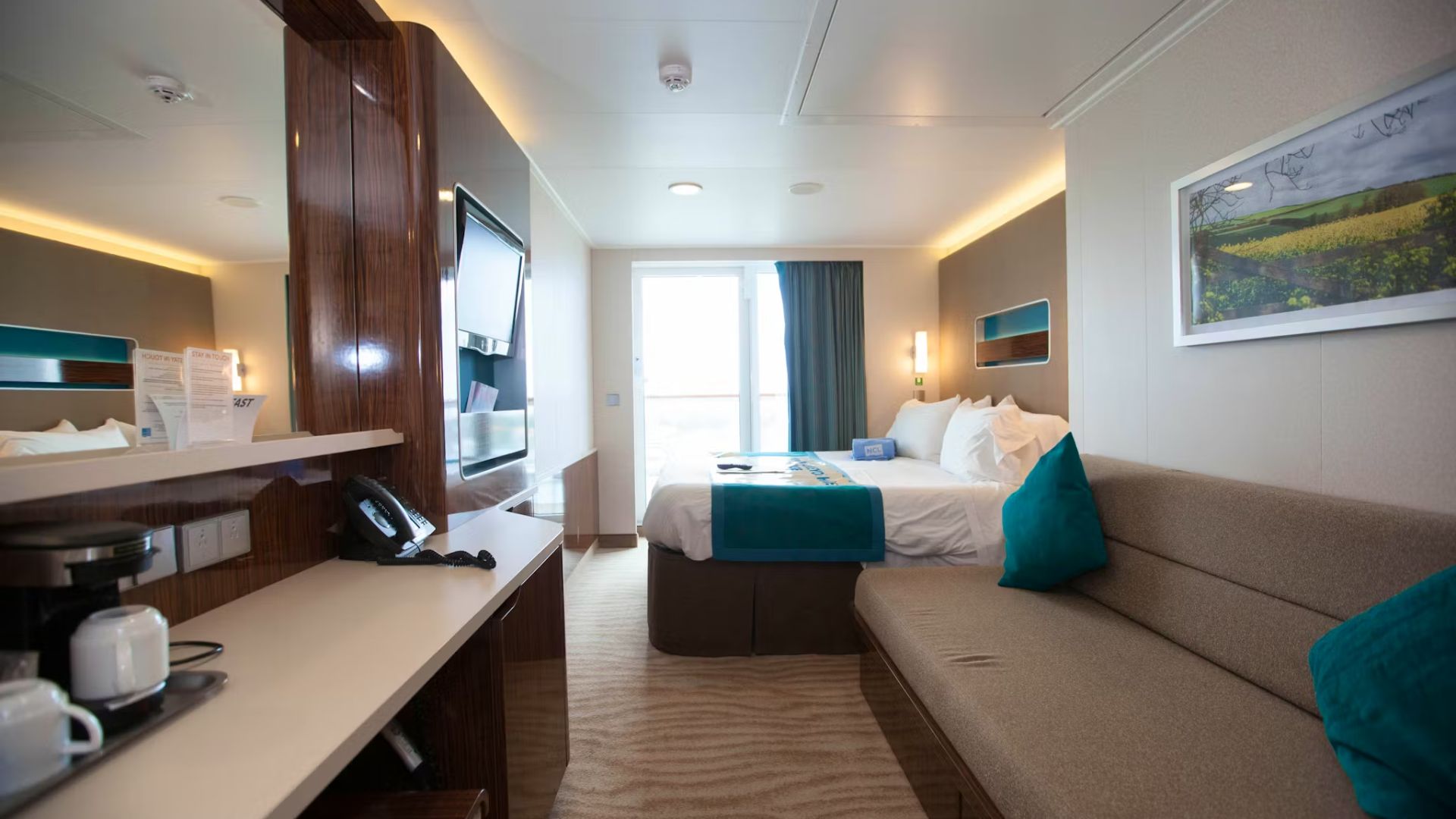 A cozy room featuring a couch and a bed, creating a comfortable living space.