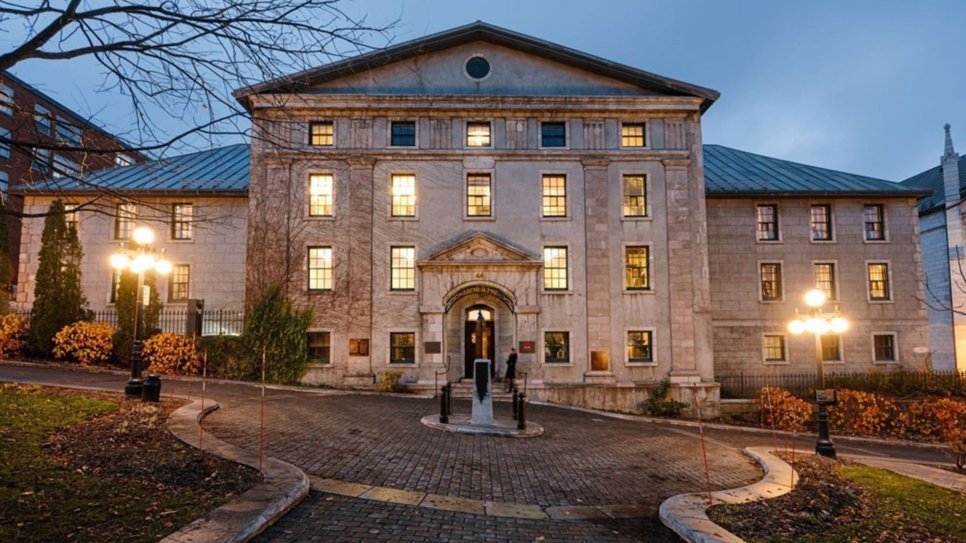The University of Ottawa campus featuring modern architecture and green spaces under a clear blue sky.