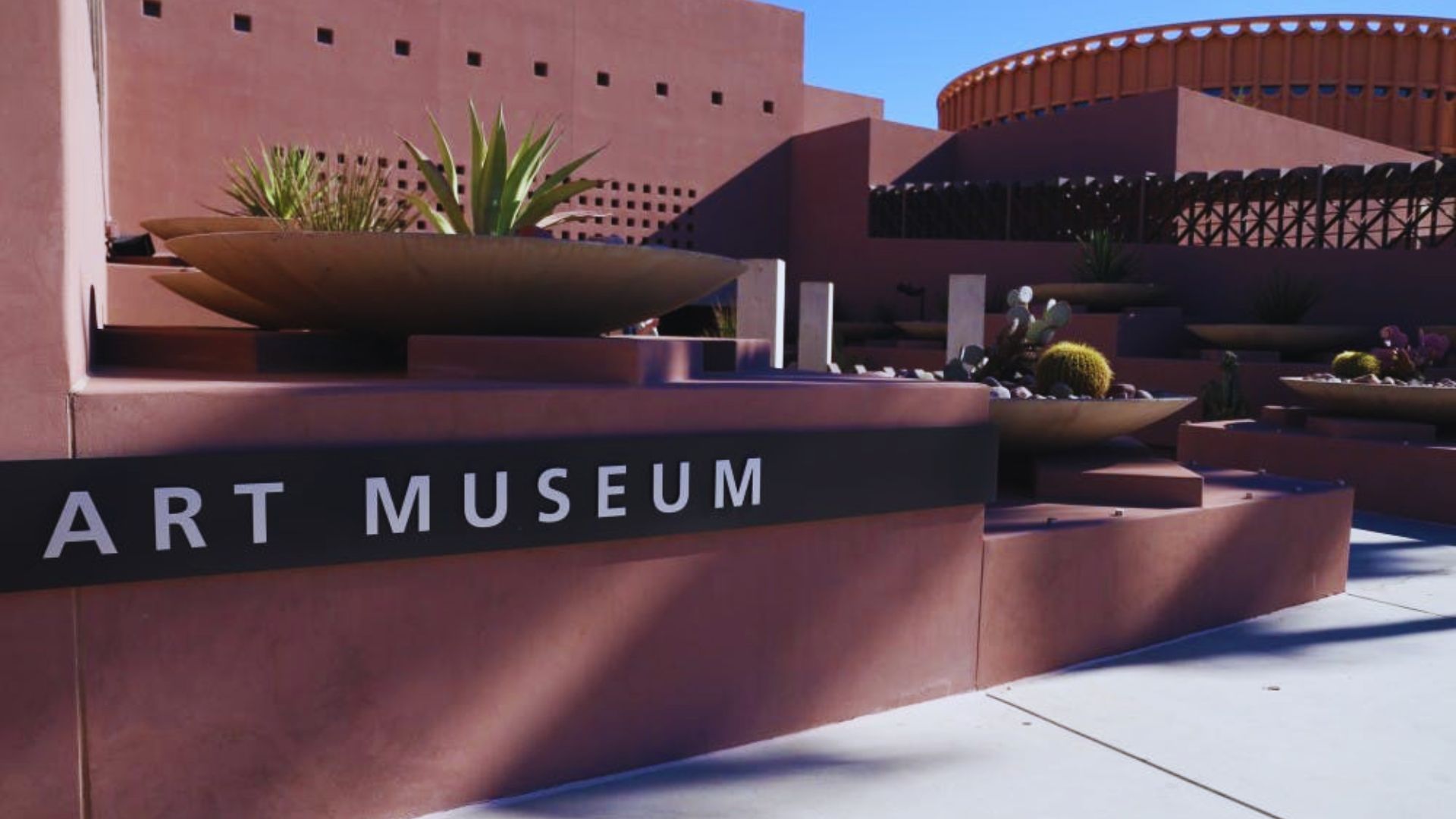 Art museum in Phoenix Valley showcasing diverse exhibits and architecture, surrounded by vibrant landscaping.