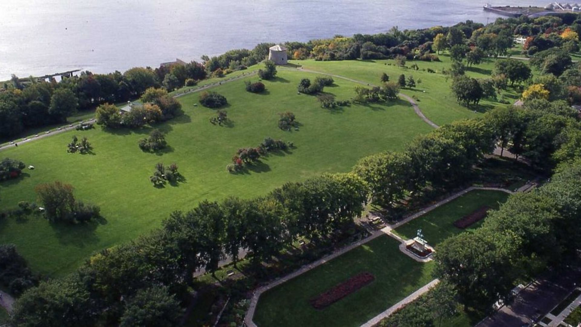 Bird's-eye view of a park filled with trees and open grassy spaces