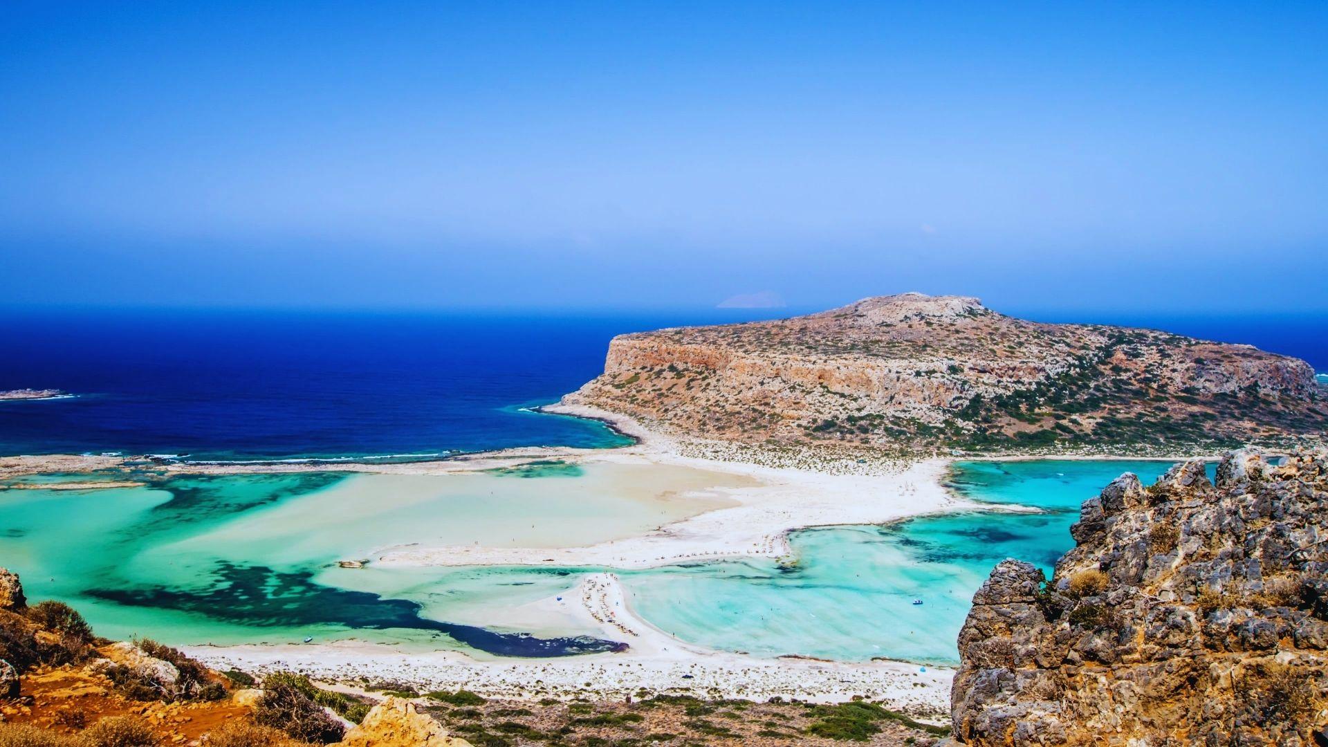 A stunning view of the island of Crete, Greece, showcasing its lush landscapes and crystal-clear waters.