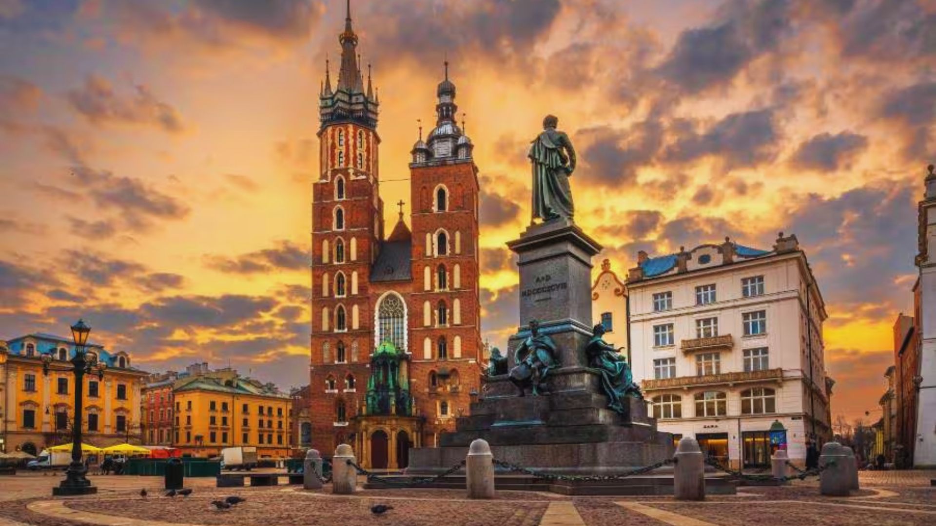 Statue of Saint Mary in Krakow, Poland, showcasing intricate details and religious significance in a historic setting.