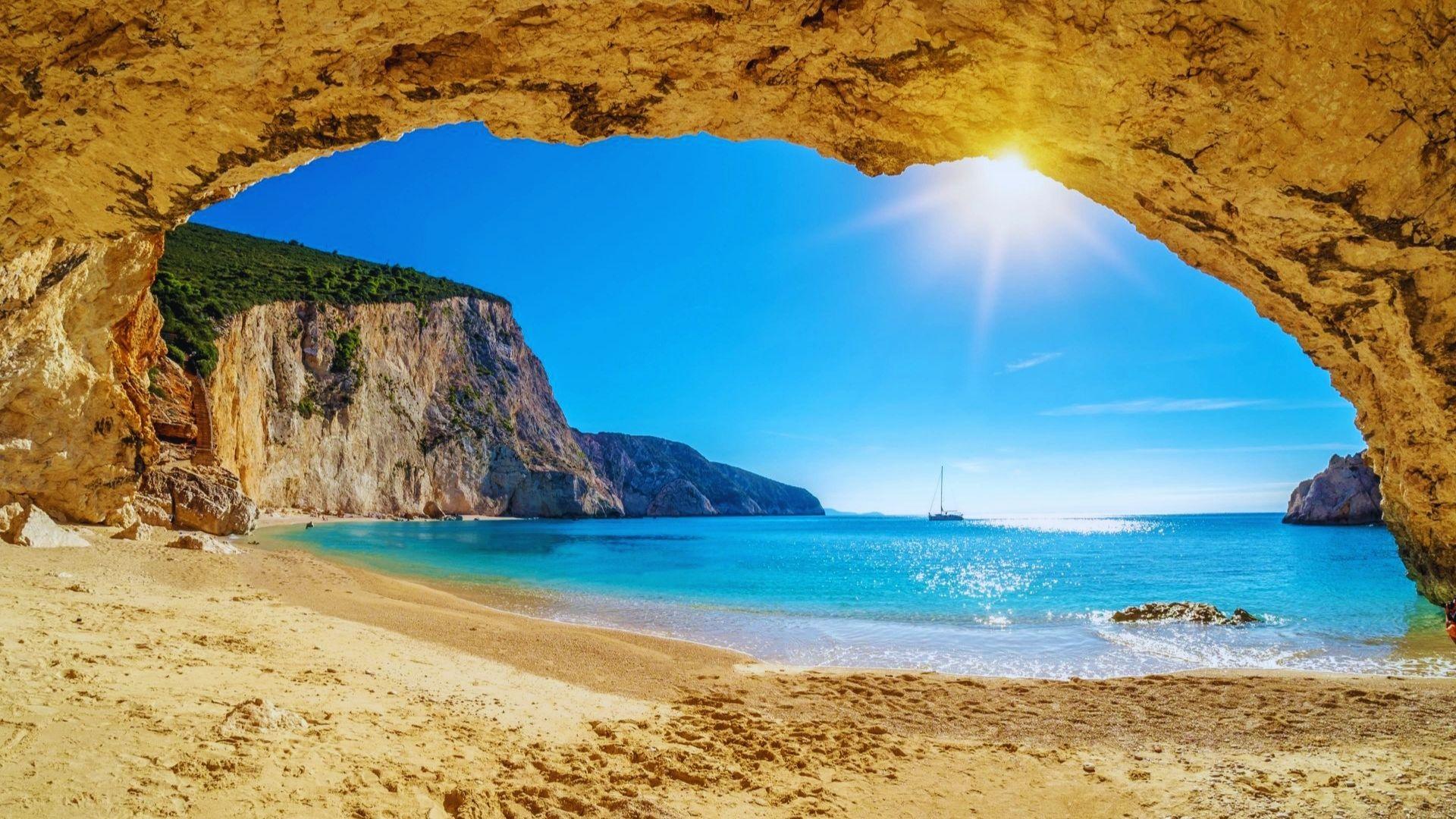 Scenic view of a beautiful beach on Zakynthos Island, Greece, featuring clear blue waters and golden sand.