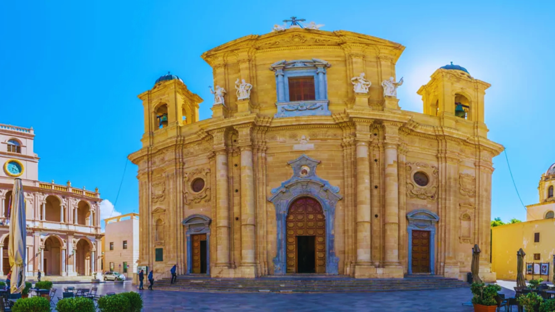 The Church of St. Lucia in Sicily, Italy, showcasing its historic architecture and surrounding landscape.