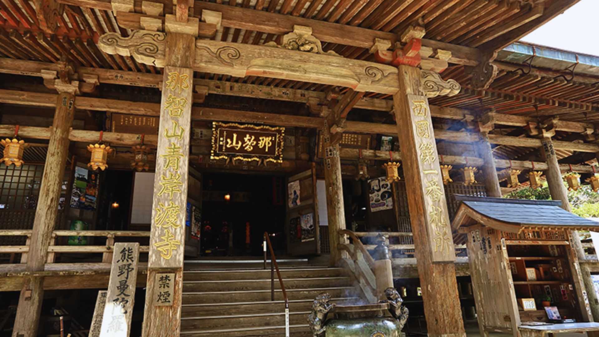 A wooden building bustling with a diverse crowd of people engaged in various activities.