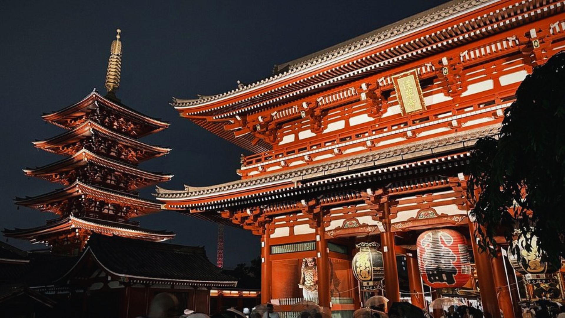 A large red pagoda stands prominently in the center of a bustling cityscape.