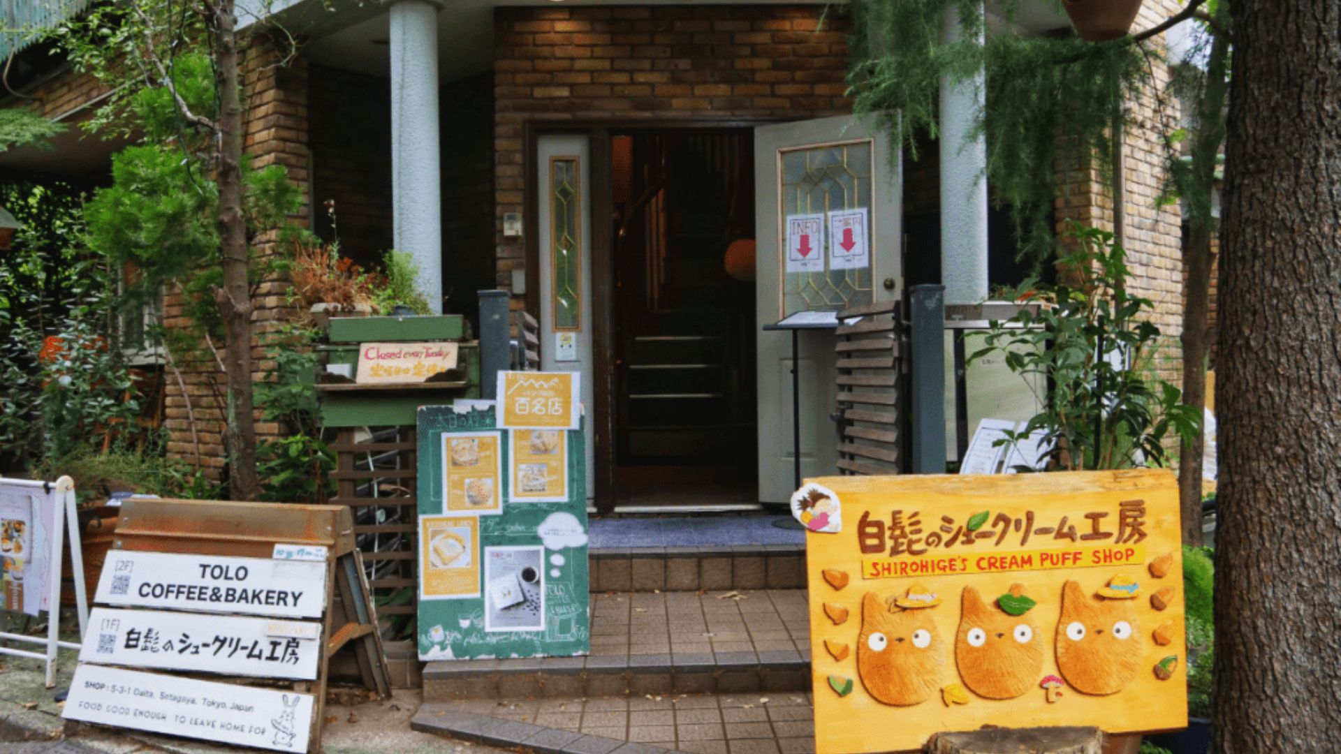 A compact building with a door sign, providing information about the establishment.