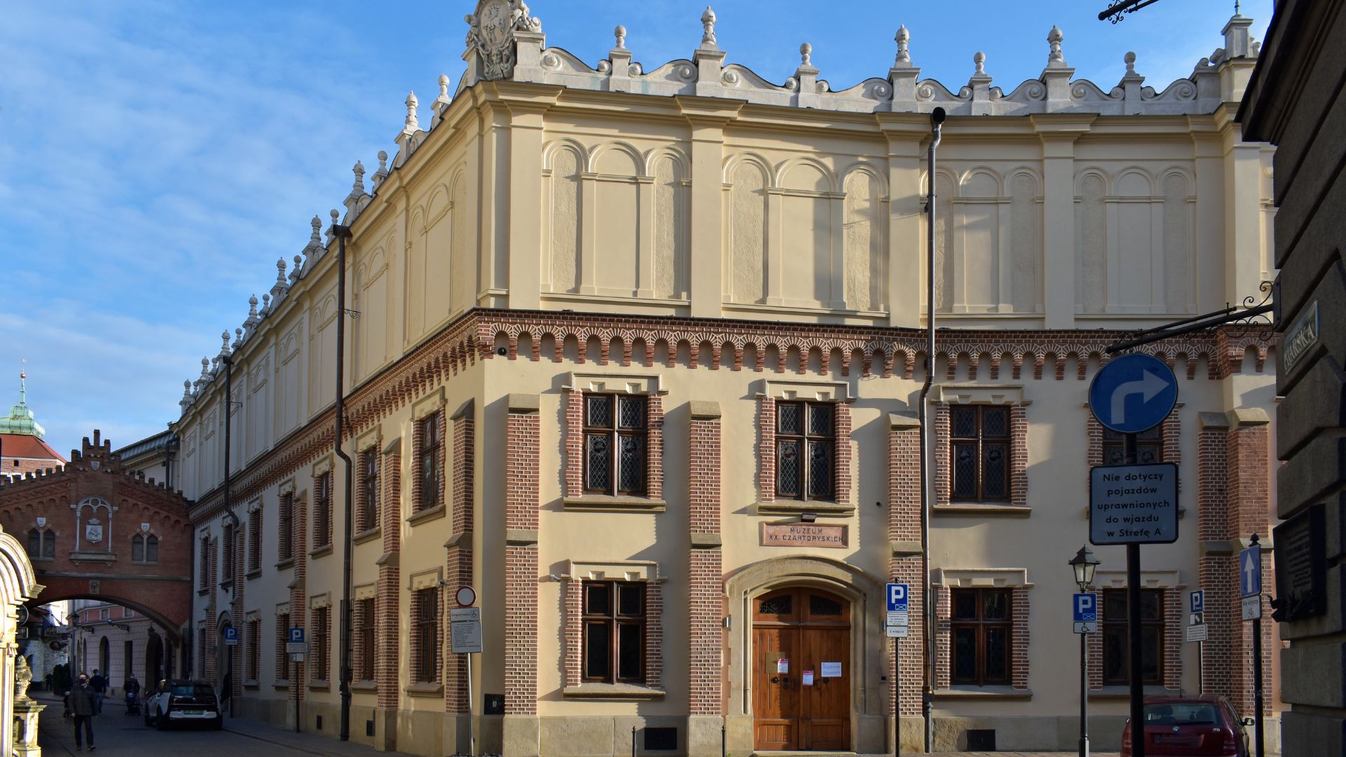 An imposing building highlighted by a tall clock tower, showcasing architectural detail.