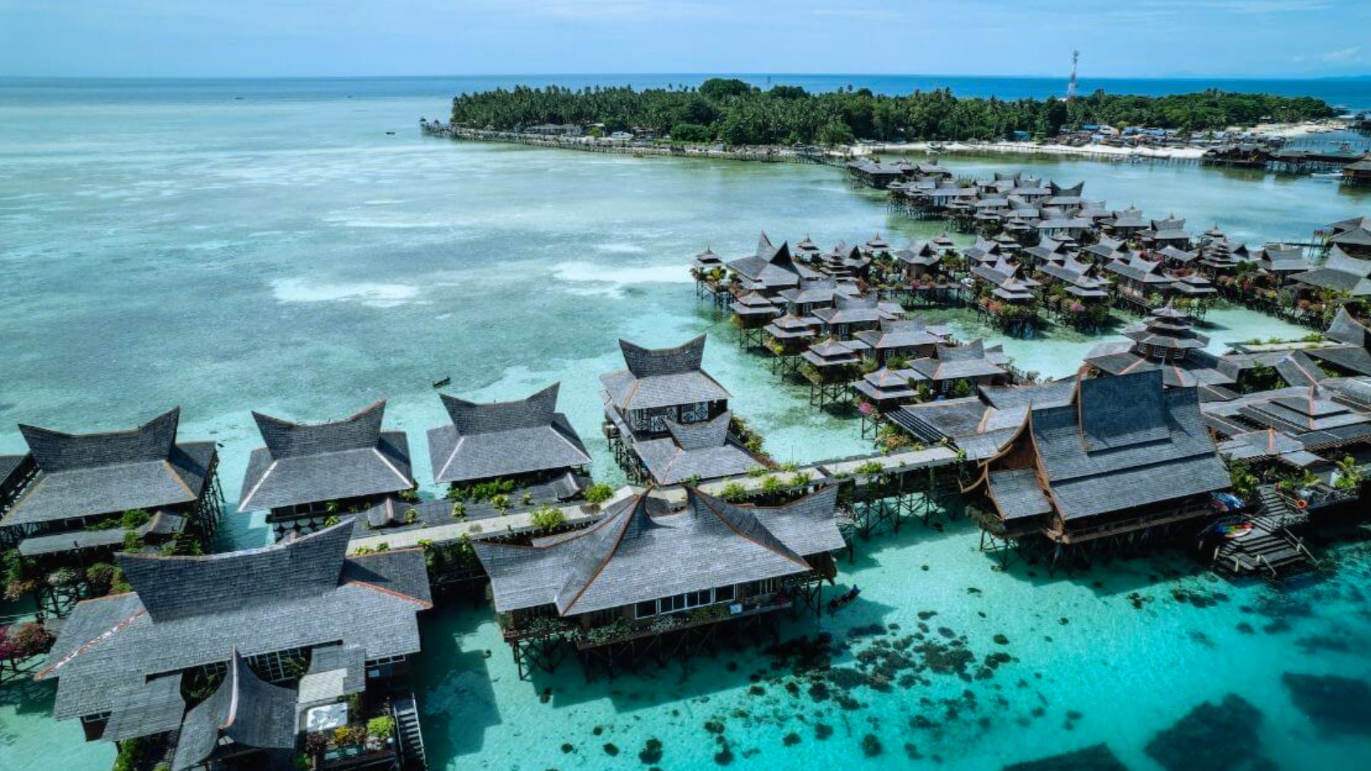 . Scenic resort with numerous huts, beautifully situated amidst tranquil waters.