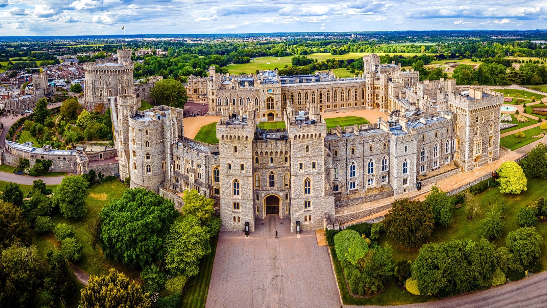 Aerial view of Windsor Castle, showcasing its historic architecture and surrounding landscape in England.