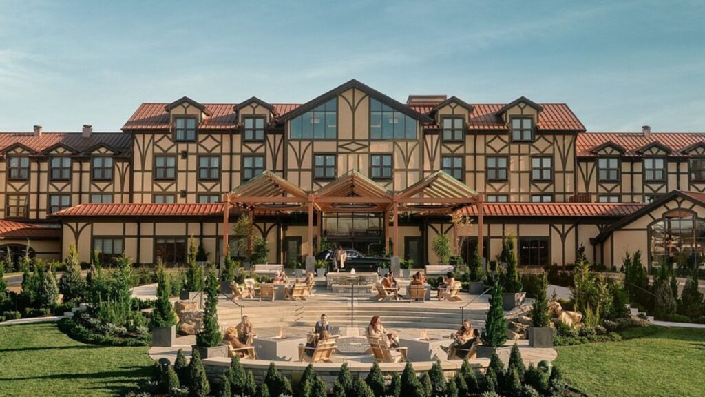 The exterior view of the St. Regis lodge, showcasing its elegant architecture and surrounding natural landscape.
