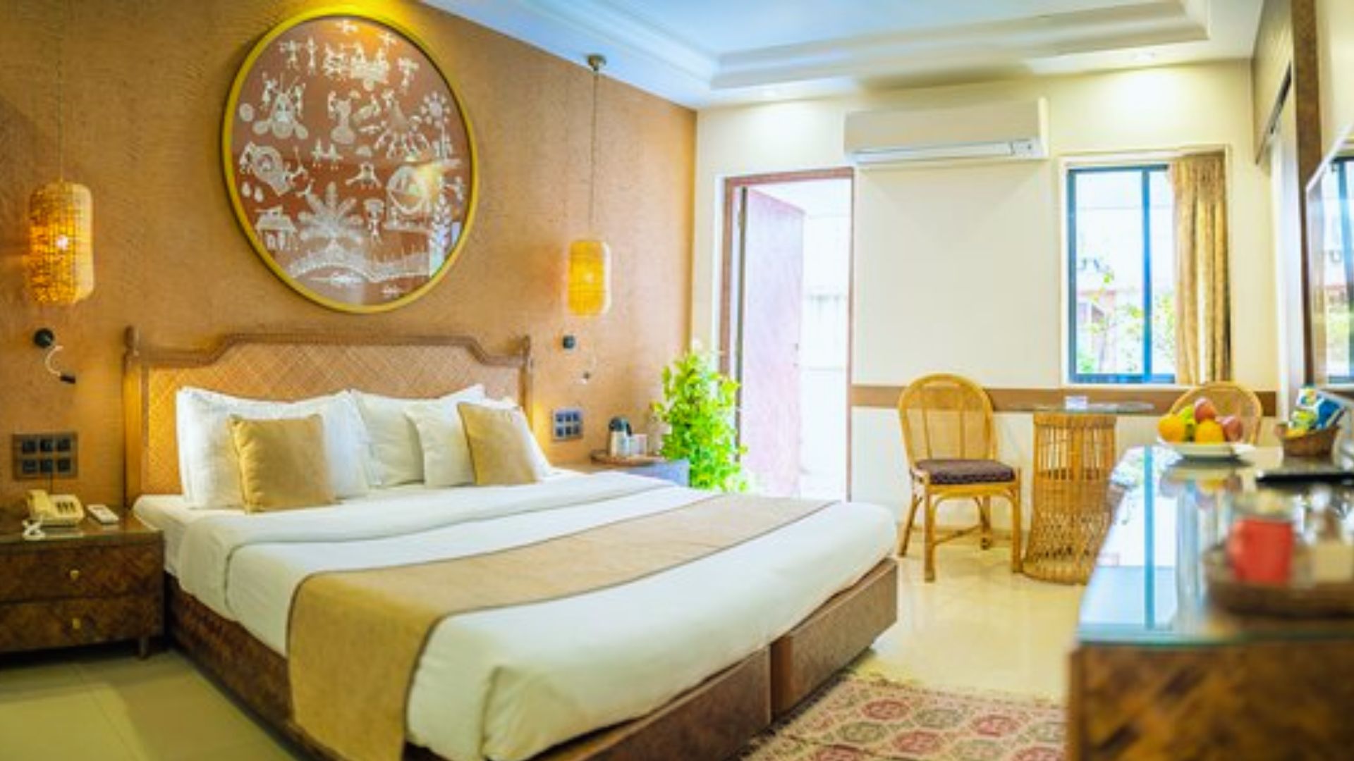 A hotel room featuring a large bed and an oversized picture hanging on the wall.